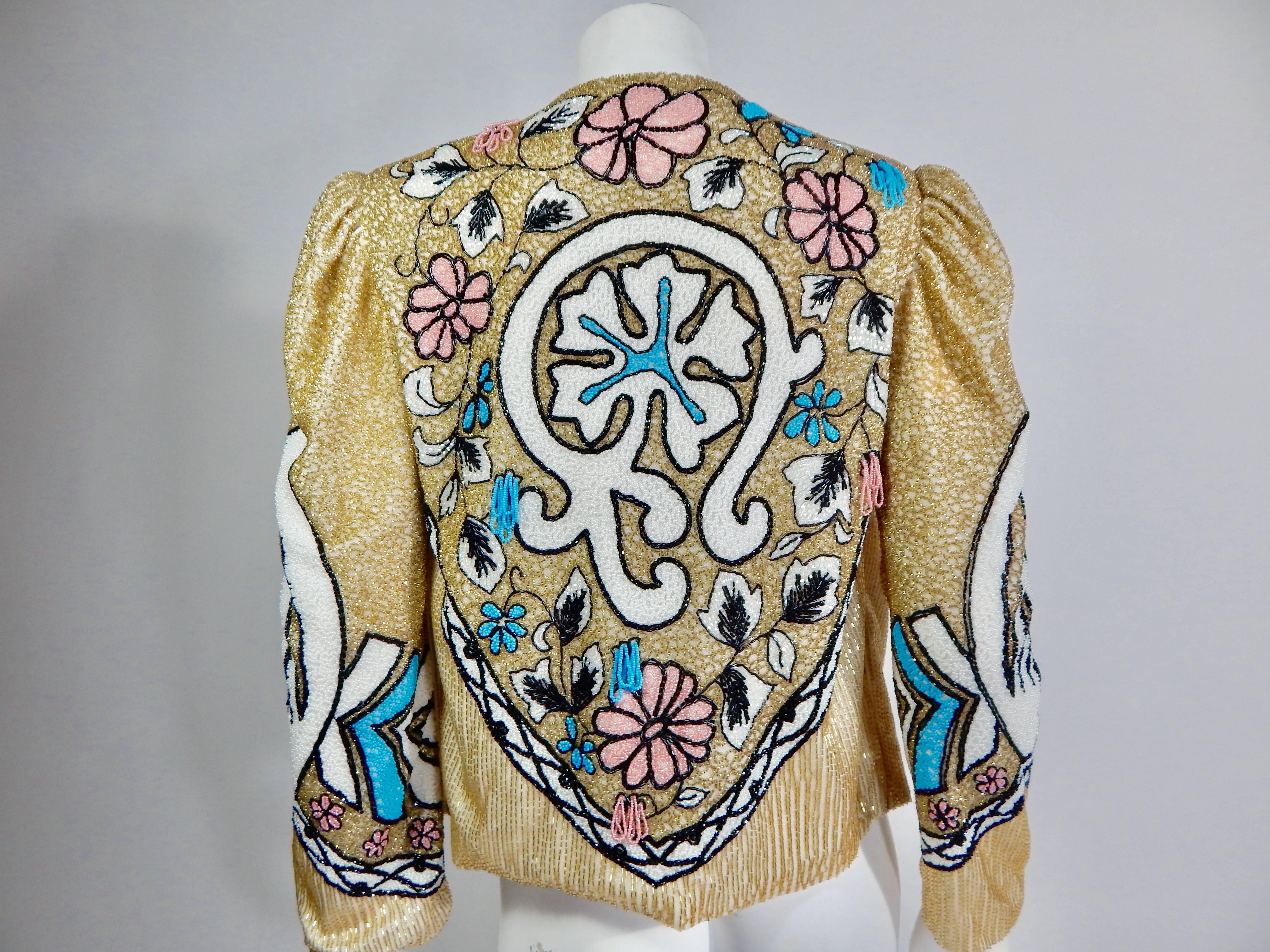 Fabulous late  1970s / early  1980s Beaded Jacket. Entirely covered in beautiful bead work.   Completely lined in off white silk. Multicolored Gold, blue, pink, black and white beading.