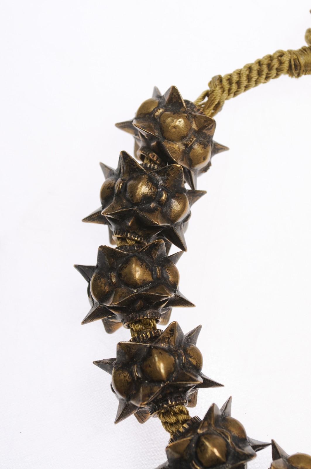 An exceptional necklace made from the metal orb charms of the Minangkabav people of West Sumatra. The charms are hand crafted from brass with a possible gold wash over them - they are likely from the early 20th Century.  There is a lovely, subtle
