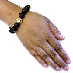 Perlen-Onyx-Armband mit Diamantkugel in Gold mit Pavé-Diamant in der Mitte