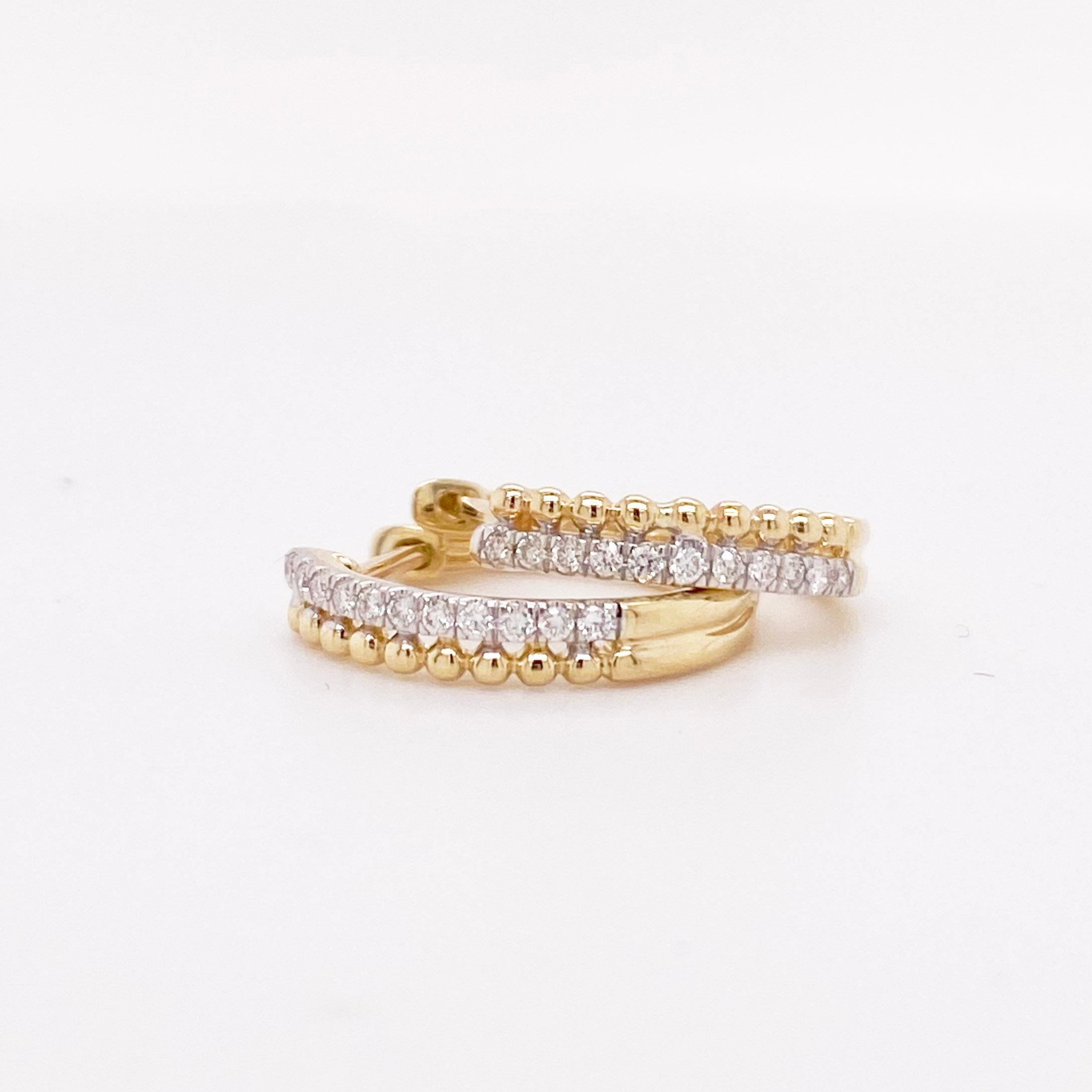 The stunning diamond huggie earrings have a two row design with one gold beaded row next to a pave diamond row. The design is dainty and modern! These earrings look amazing on their own and can easily be paired with other earrings for a custom