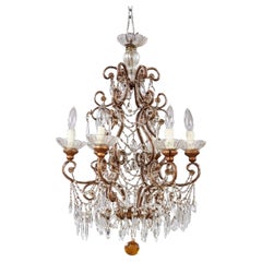 Lampadario con volute di perline
