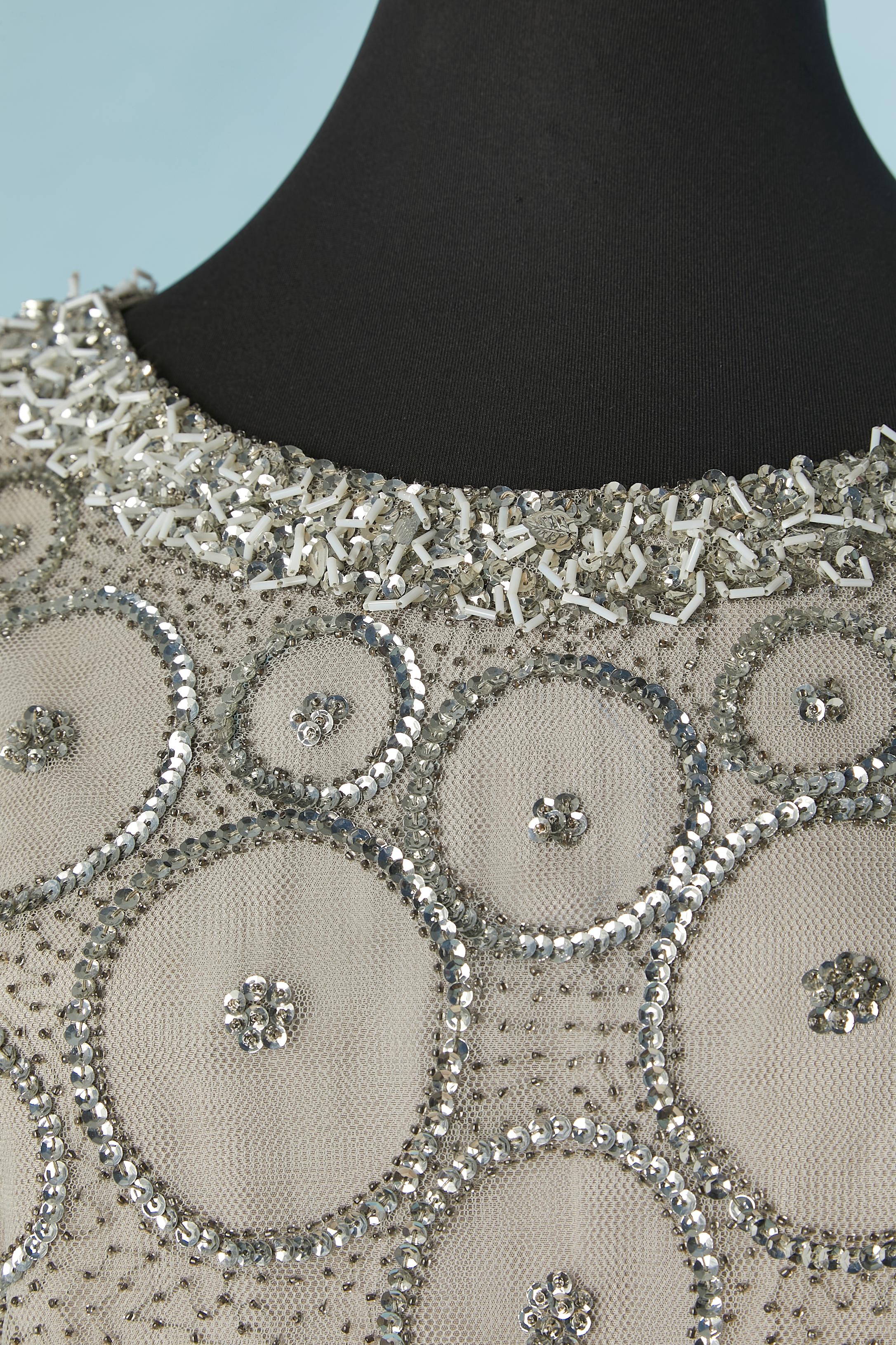 Beaded tulle sleeveless cocktail dress with dégradé colors. Probably acetate lining. 
Zip and hook&eye closure on the middle back. 
SIZE 46 ( It) on tag but fit more likely M 