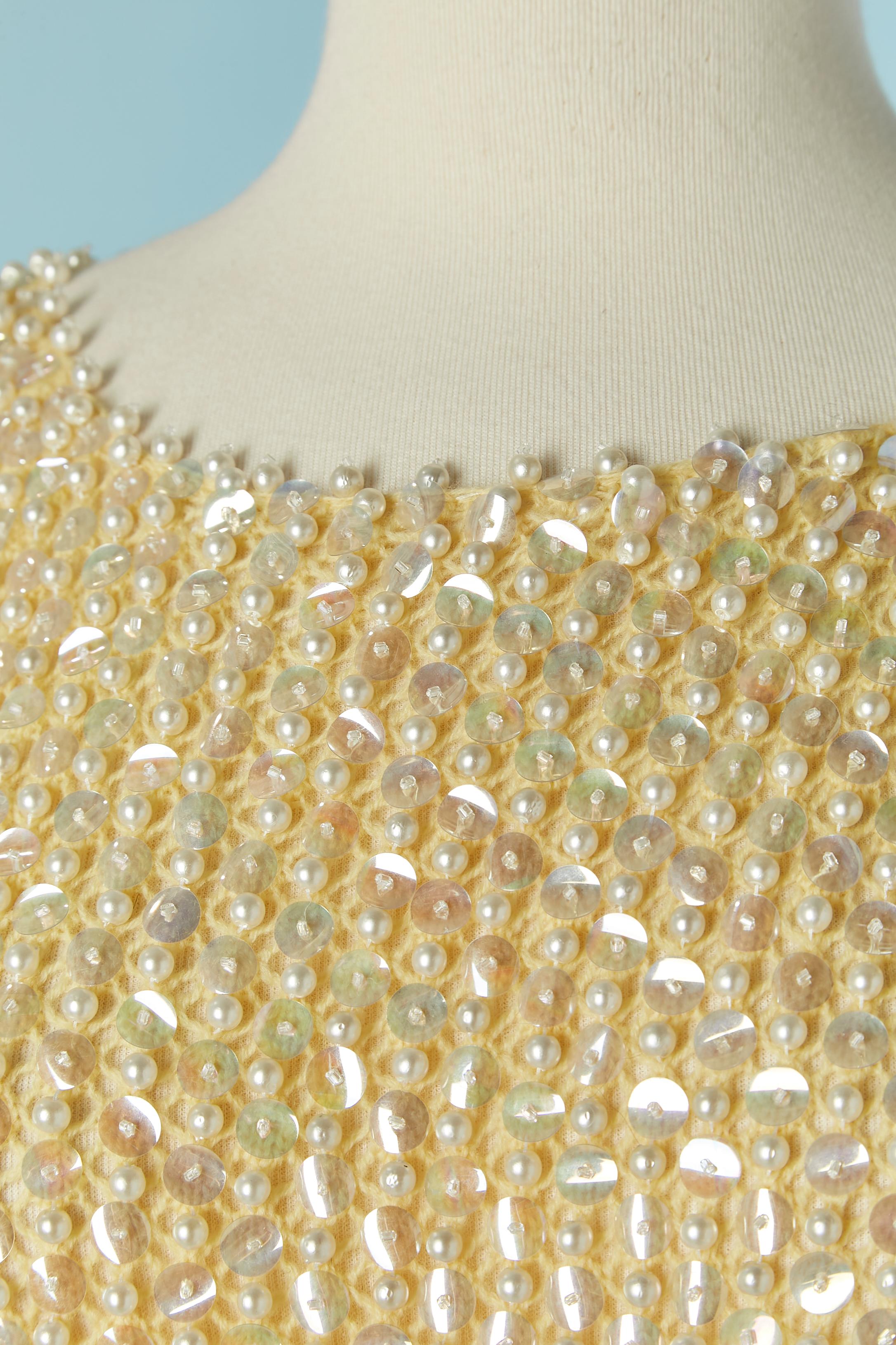 Beaded top on yellow knit base. 
SIZE M 
