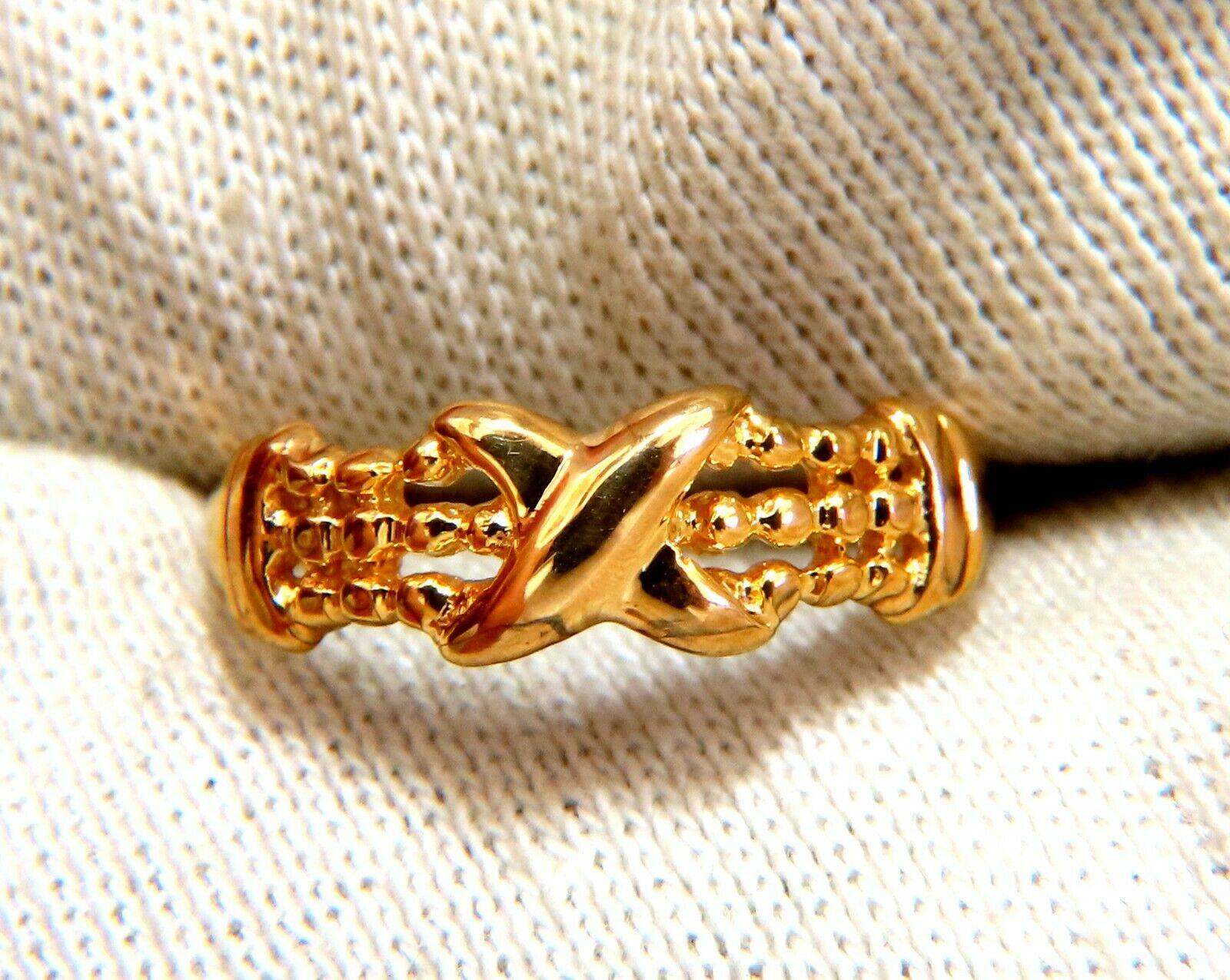 X beaded gold ring.

6 mm wide

1.9 mm depth

14 karat yellow gold 1.8 g