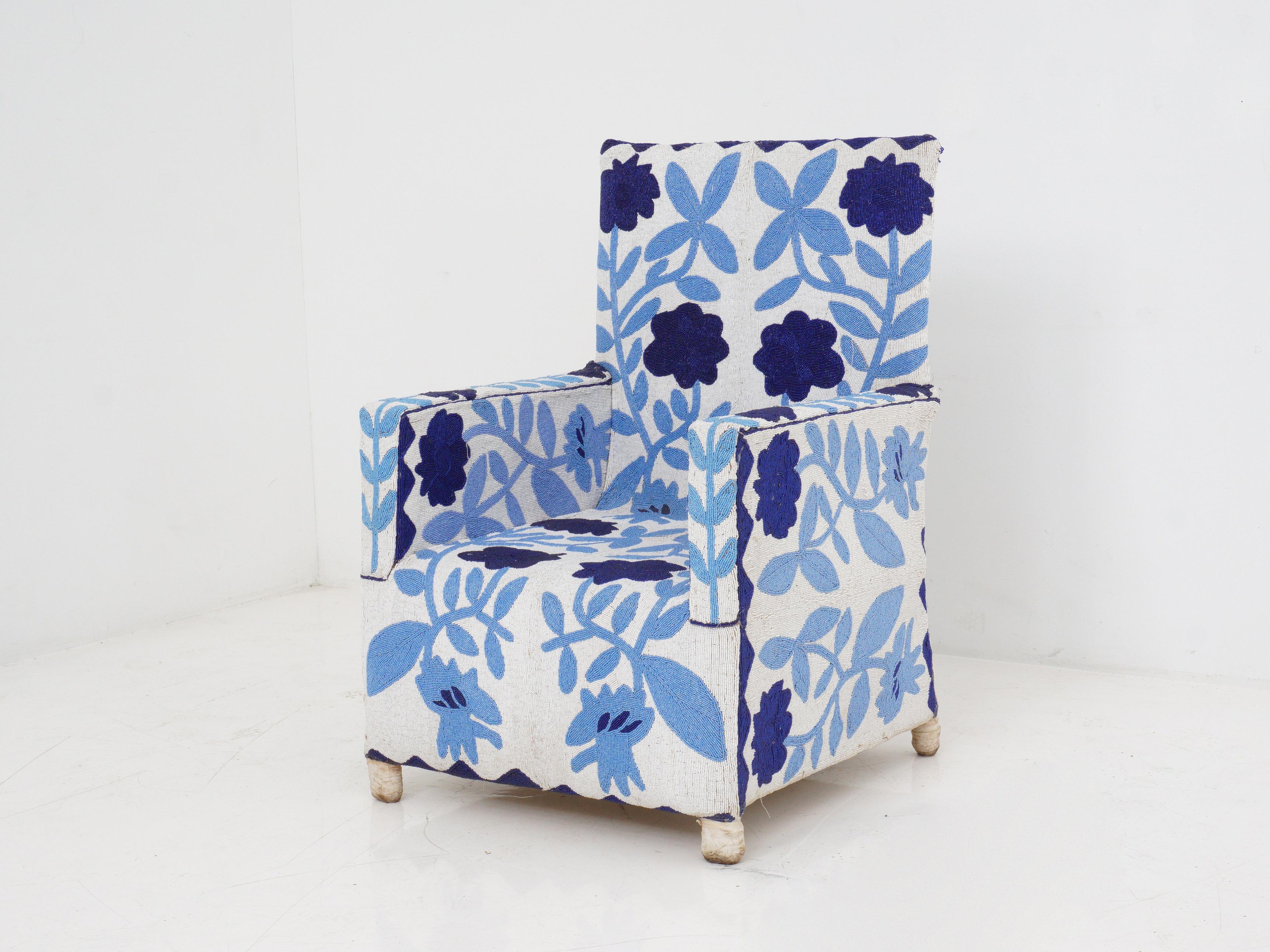 Take a seat in a masterpiece of Yoruba craftsmanship with this captivating hand-beaded chair, adorned in a mesmerizing white and blue design that adds a touch of artistry to any space.

Yoruba chairs have a rich history rooted in the cultural