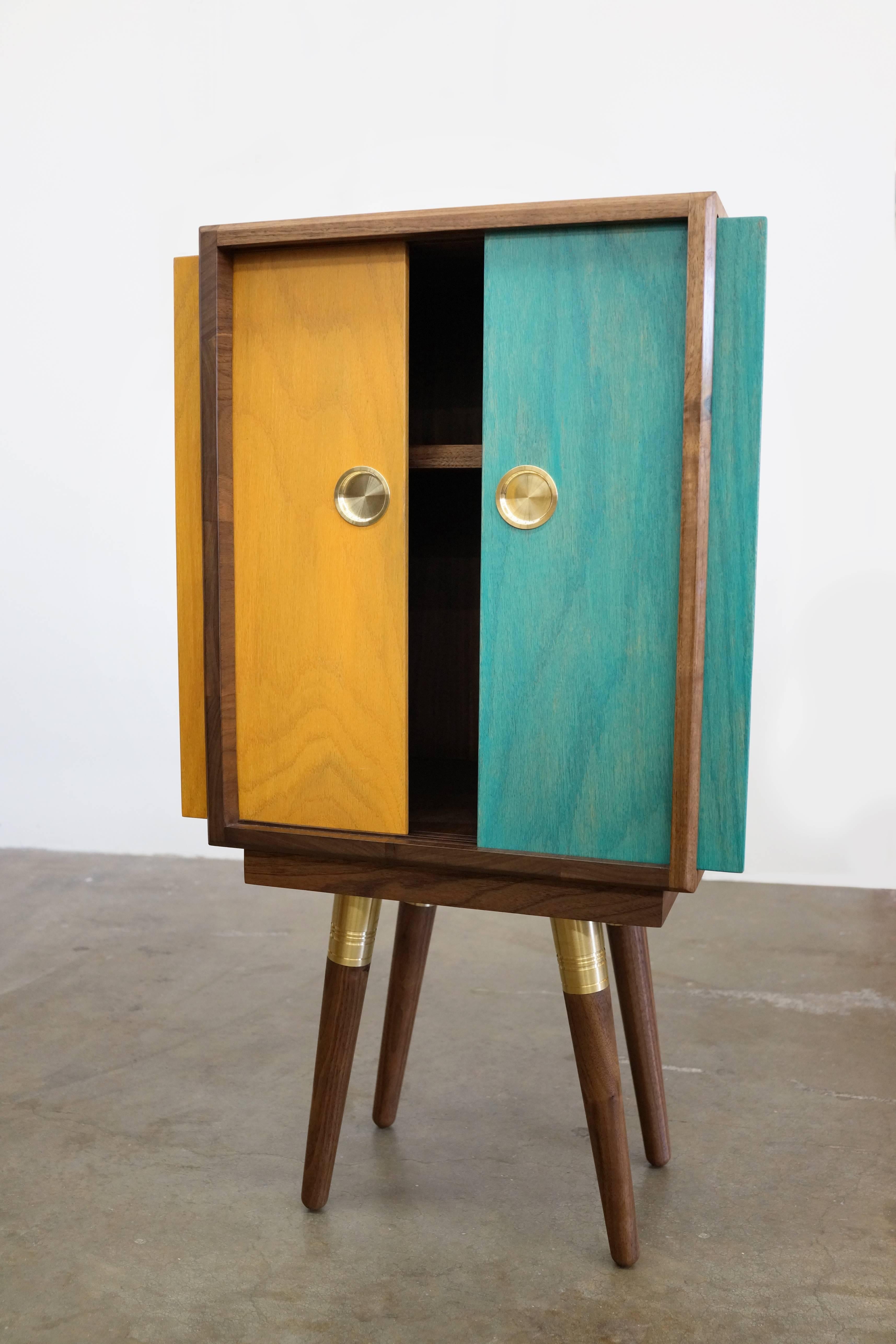 Beaker is our petite cabinet, ready to house your favorite things. While diminutive in size, Beaker is huge in character. Brightly colored sliding doors are hand-painted and inlaid with custom brass finger pulls. 

We think Beaker will make a