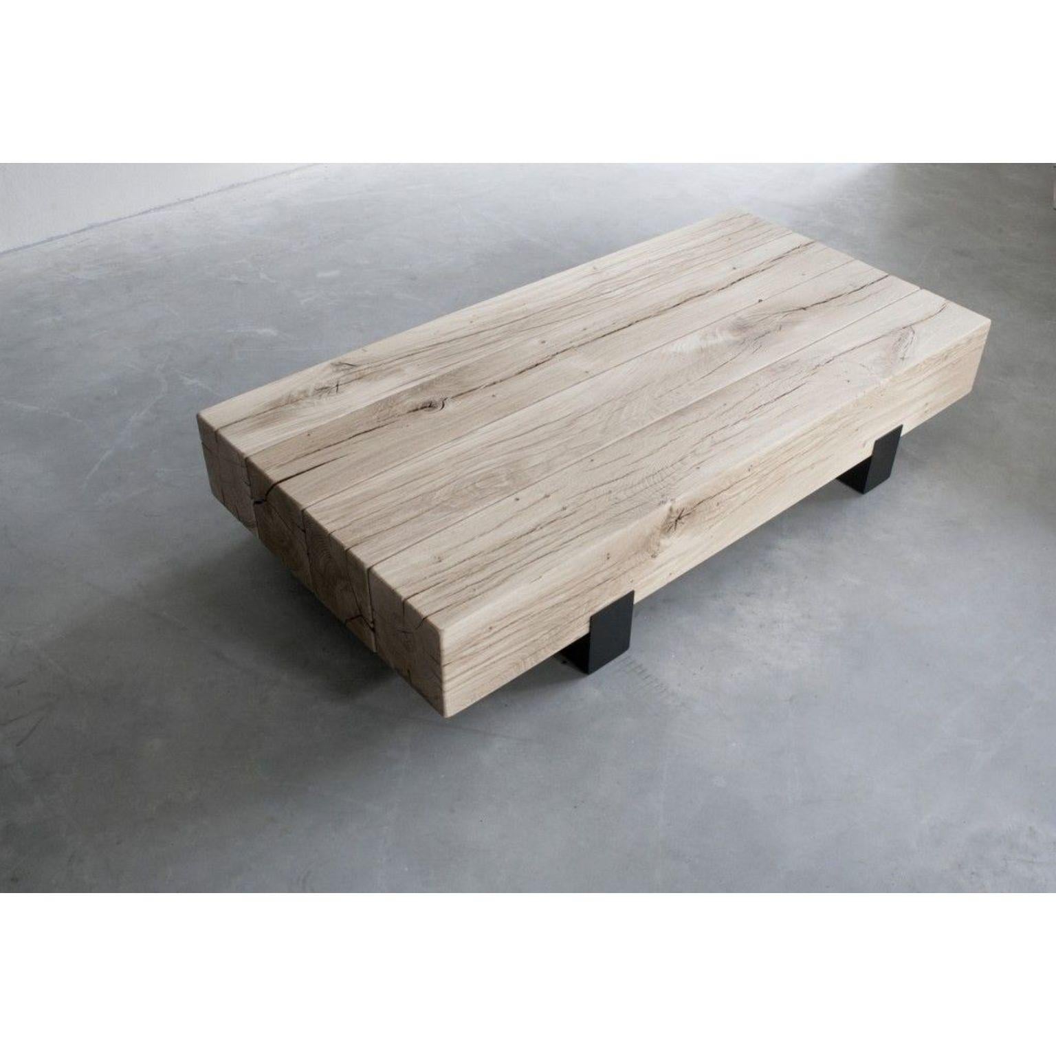 Beam rectangular coffee table by Van Rossum.
Dimensions: D100 x W127 x H28 cm
Materials: Oak, steel.

The wood is available in all standard Van Rossum colors, or in a matching finish to customer’s own sample.
The steel is available in four