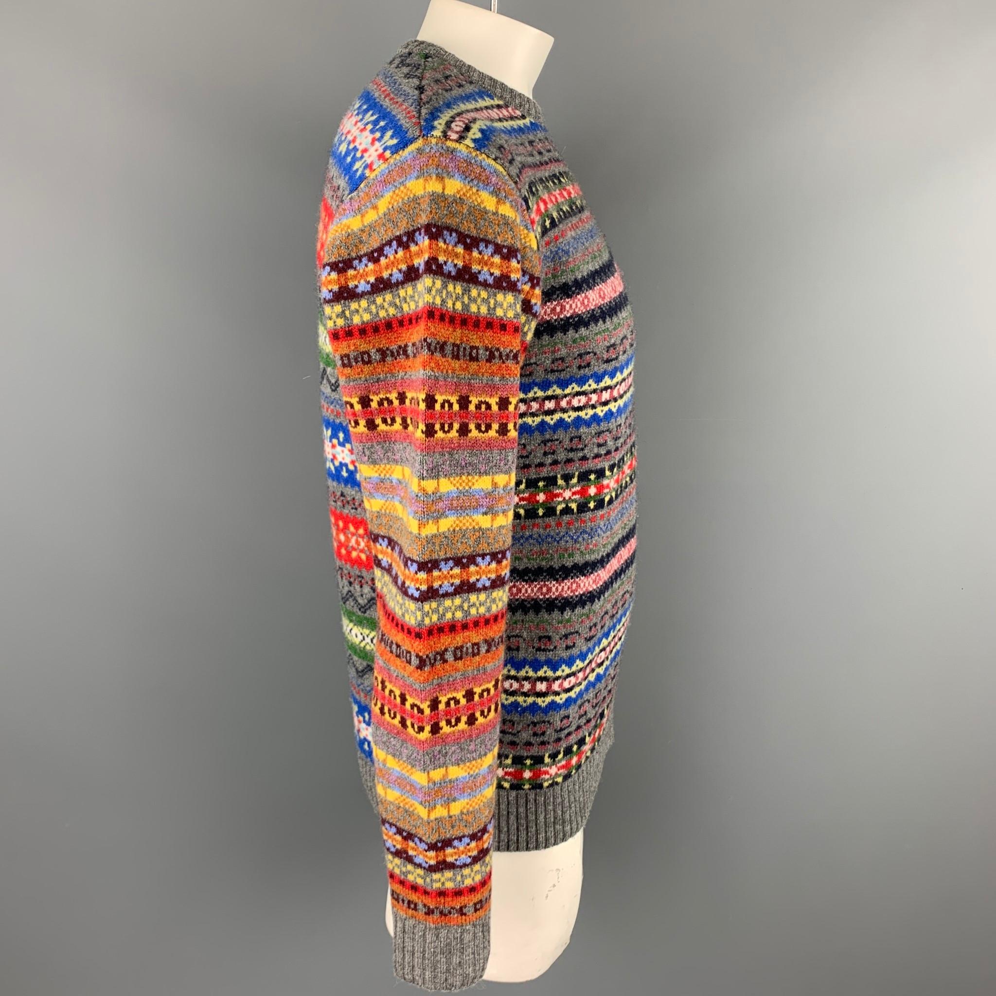 BEAMS PLUS sweater comes in a multi-color fairisle wool / nylon featuring a crew-neck.

Very Good Pre-Owned Condition.
Marked: L

Measurements:

Shoulder: 20 in. 
Chest: 44 in. 
Sleeve: 26.5 in. 
Length: 27.5 in. 
 
