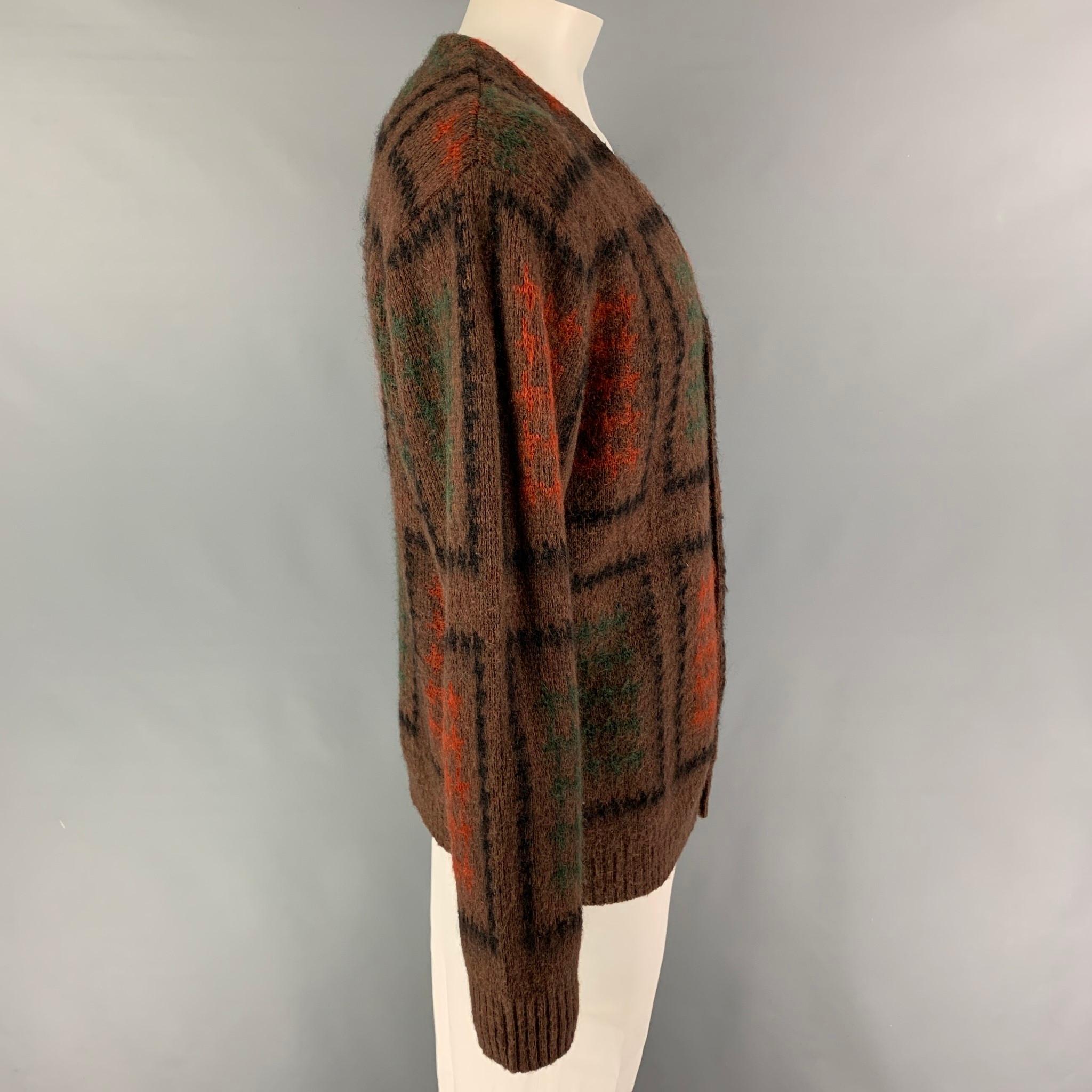 BEAMS PLUS cardigan comes in a multi-color pattern mohair blend featuring a buttoned closure. 

Very Good Pre-Owned Condition.
Marked: XL

Measurements:

Shoulder: 21 in.
Chest: 46 in.
Sleeve: 27 in.
Length: 27.5 in. 