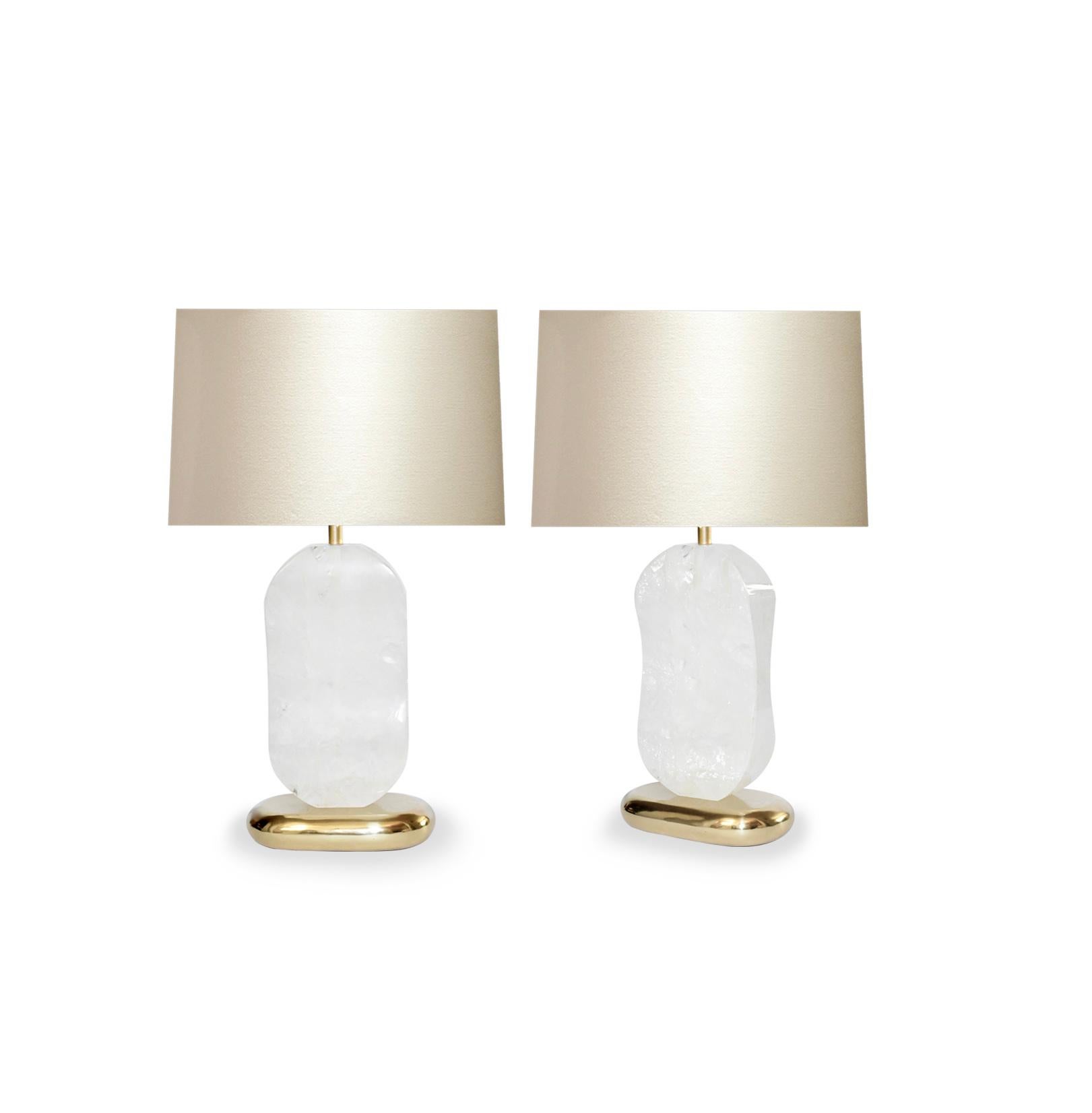 Pair of carved oval form rock crystal quartz lamps with polished brass bases. Created by Phoenix Gallery, NYC.
Measure: To the top of rock crystal: 14.35