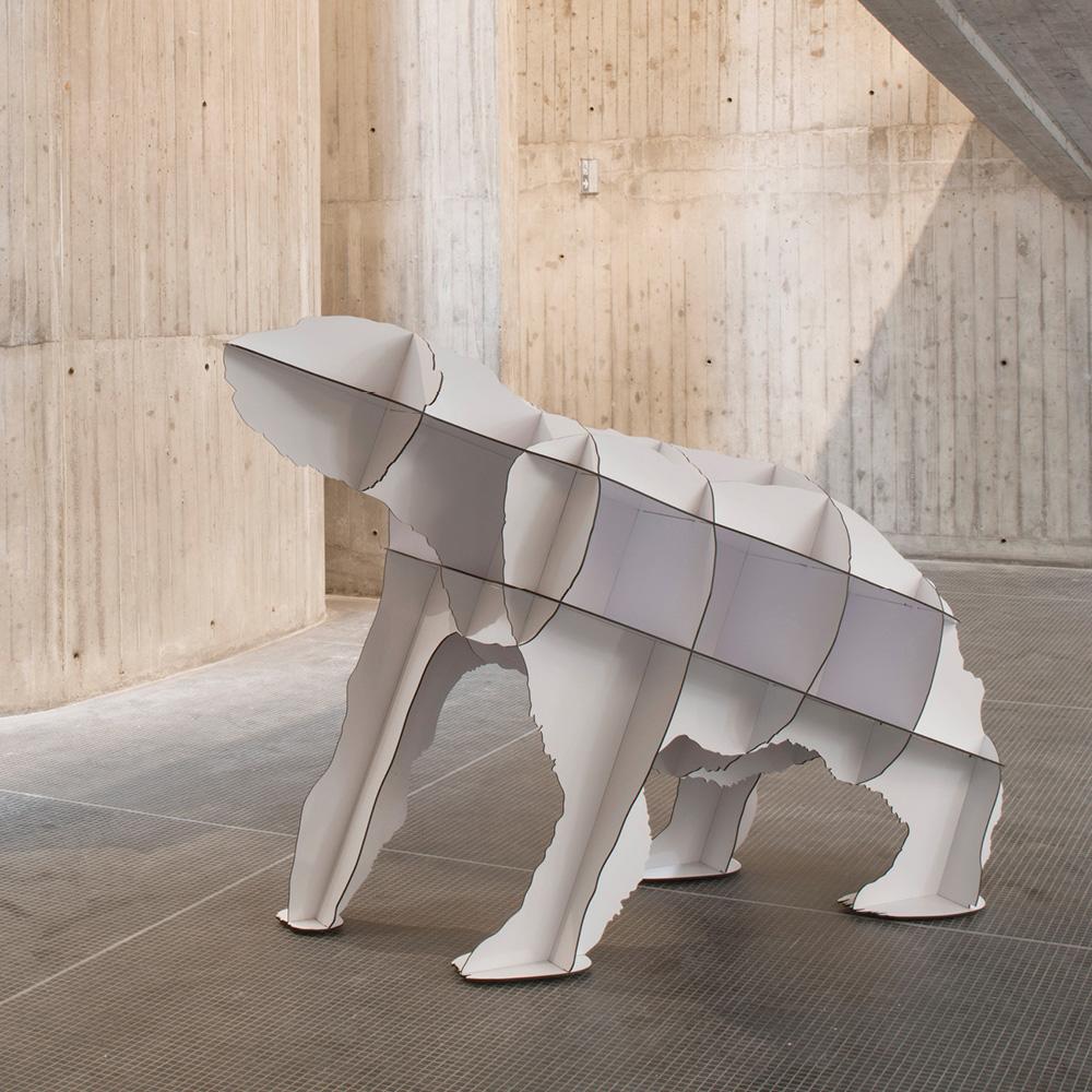 A sculptural polar bear, Joe is the first predator in the pet furniture range. Joe enhances his owner's cultural experience. In perfect harmony with its function as a library, the bear gains weight, volume, and power as it is filled with books. A
