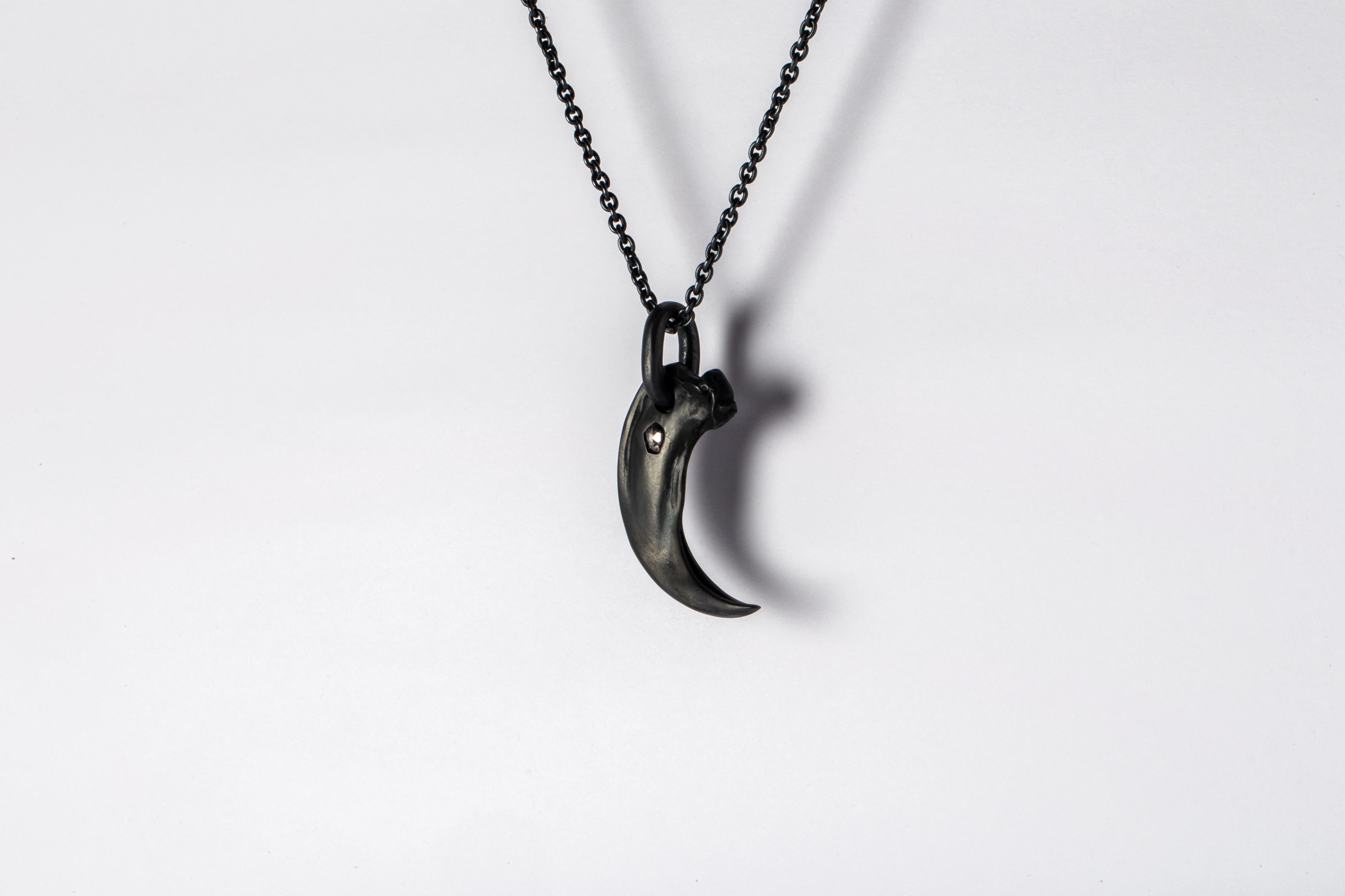 Pendant necklace in the shape of a bear claw in sterling silver and a slab of rough diamond. This slab is removed from a larger chunk of diamond, it comes on a 74cm chain. This item is made with a naturally occurring element and will vary from the