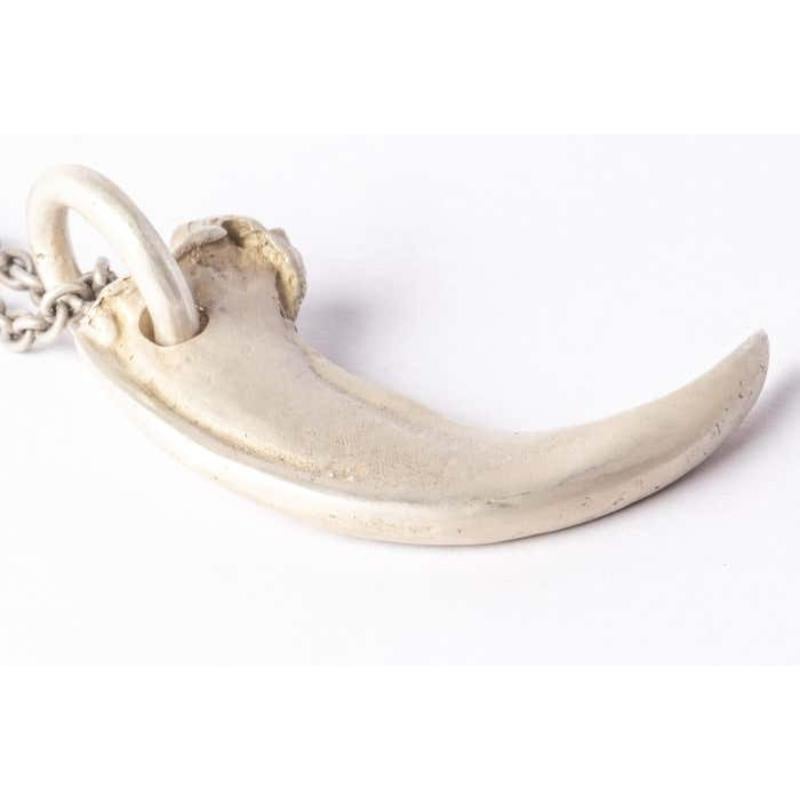 Pendant necklace in the shape of a bear claw in brass, it comes on a 74cm sterling silver chain. Brass substrate is electroplated with silver and then dipped into acid to create the subtly destroyed surface. This item is made with deep respect to