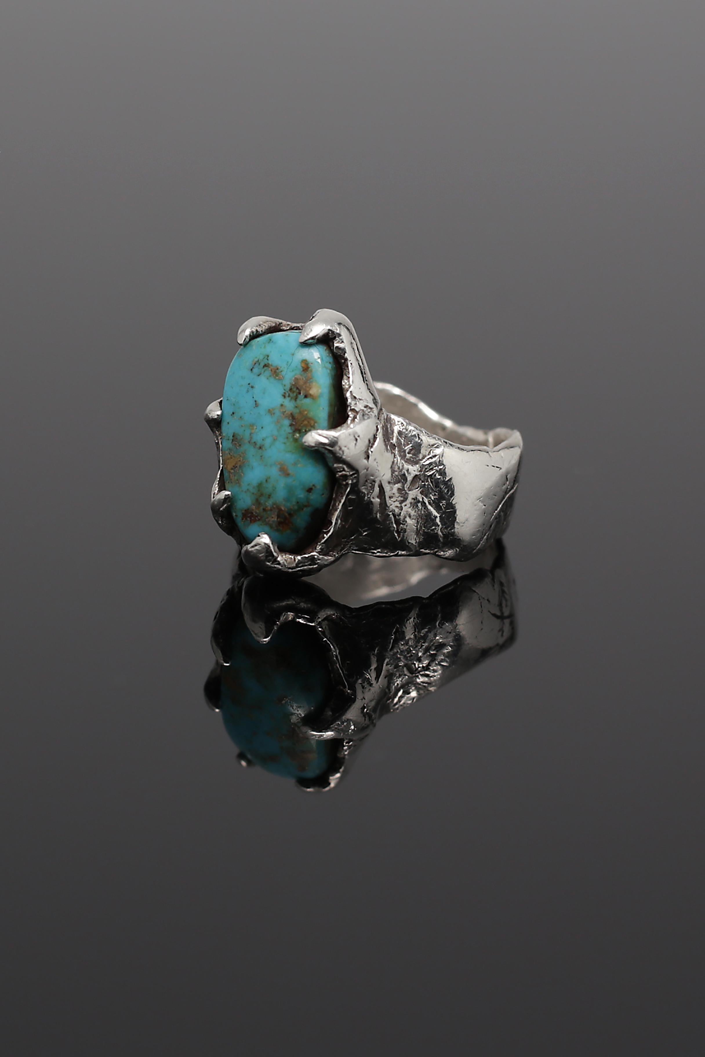 Bear Claw is a one-of-a-kind handmade ring by Ken Fury that is hand-carved, cast in sterling silver, and features a turquoise stone.

Ring size: 7