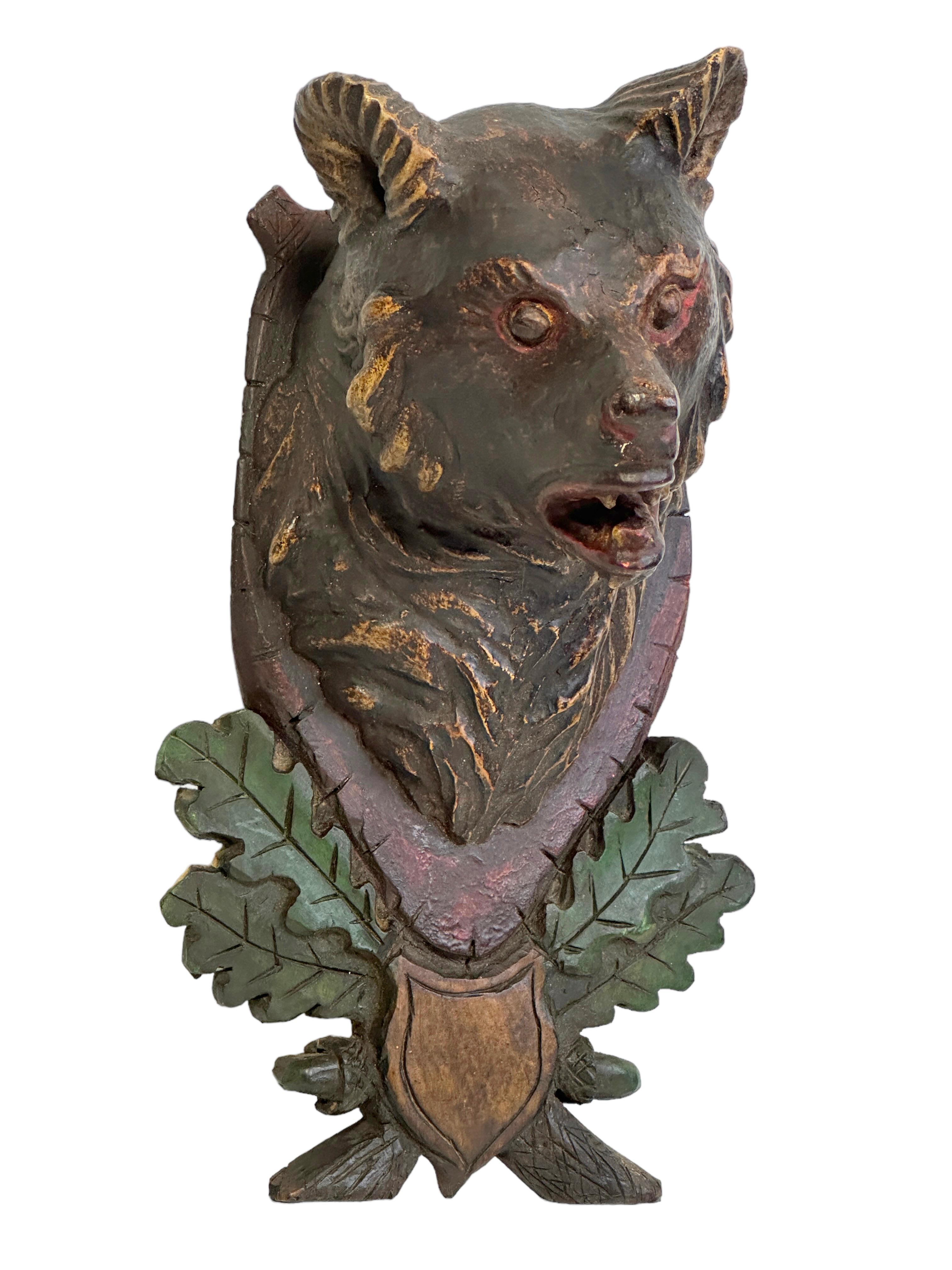 A great looking hand carved original wooden Folk Art Bear head wall decoration. A great piece for a suitable ambiance in a trophy room or the office of a Hunter or Woodsman. More than likely one of the Folk Art items made between 1860 and the late