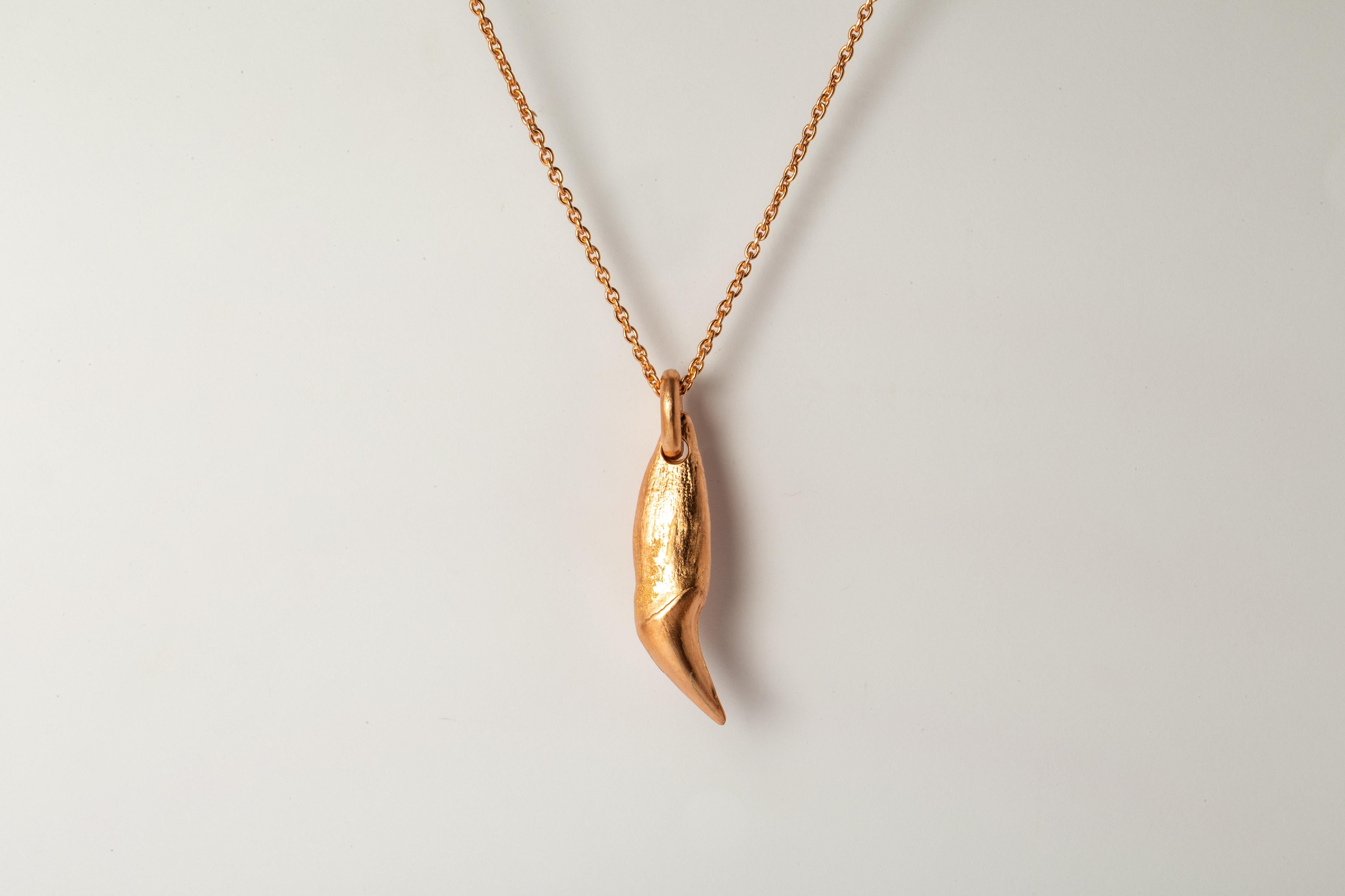 Pendant necklace in the shape of a bear tooth in brass, it comes on a 74cm sterling silver chain. Brass and sterling silver substrates are electroplated with 18k Rose Gold and then dipped into acid to create the subtly destroyed surface. This item
