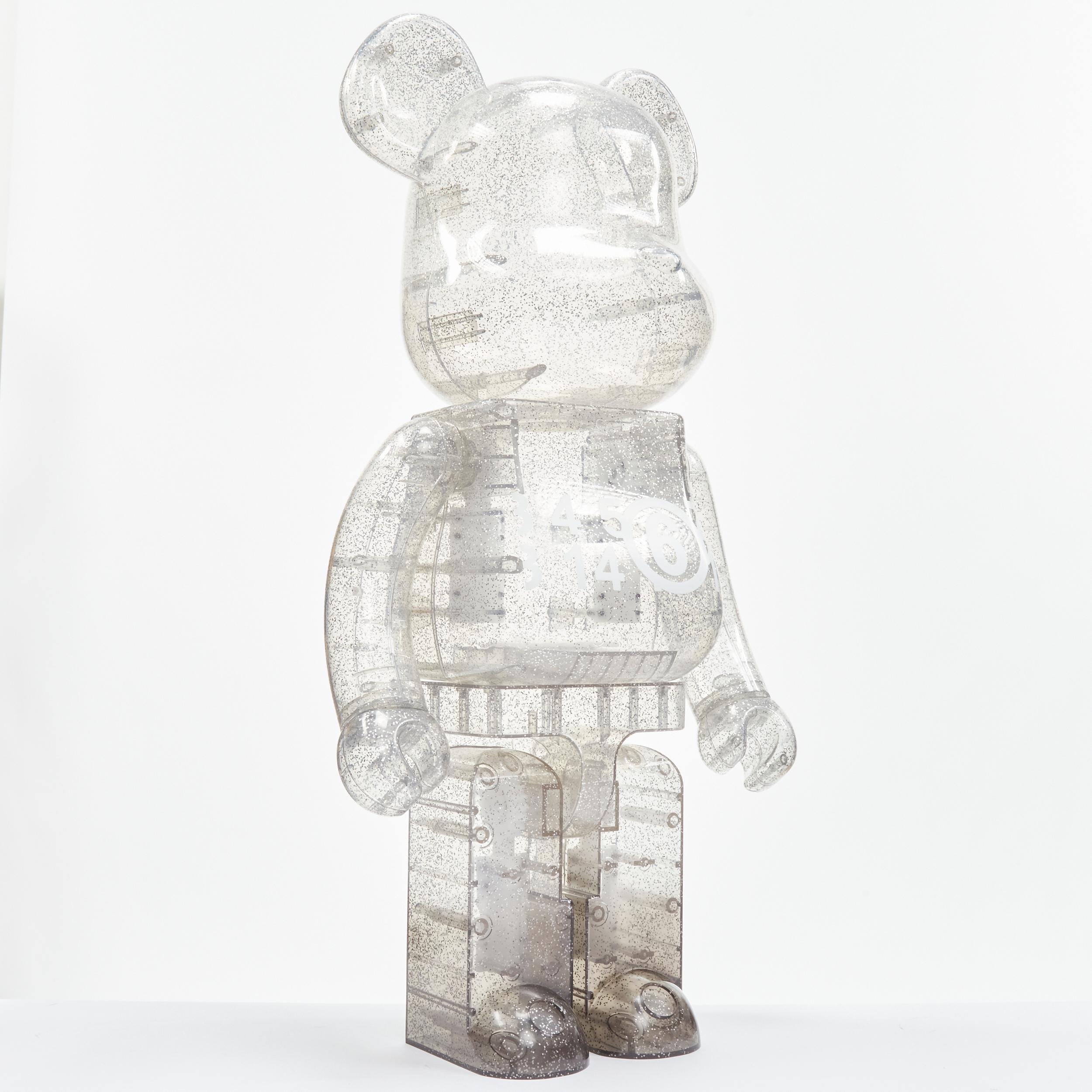 BEARBRICK 100% MAISON MARGIELA MM6 Macau 2020 clear silver glitter figurine 
Reference: JOMK/A00028 
Brand: Bearbrick 
Designer: Maison Margiela MM6 
Material: Plastic 
Color: Silver 
Extra Detail: Adjustable Cast Vinyl Figure 

CONDITION:
