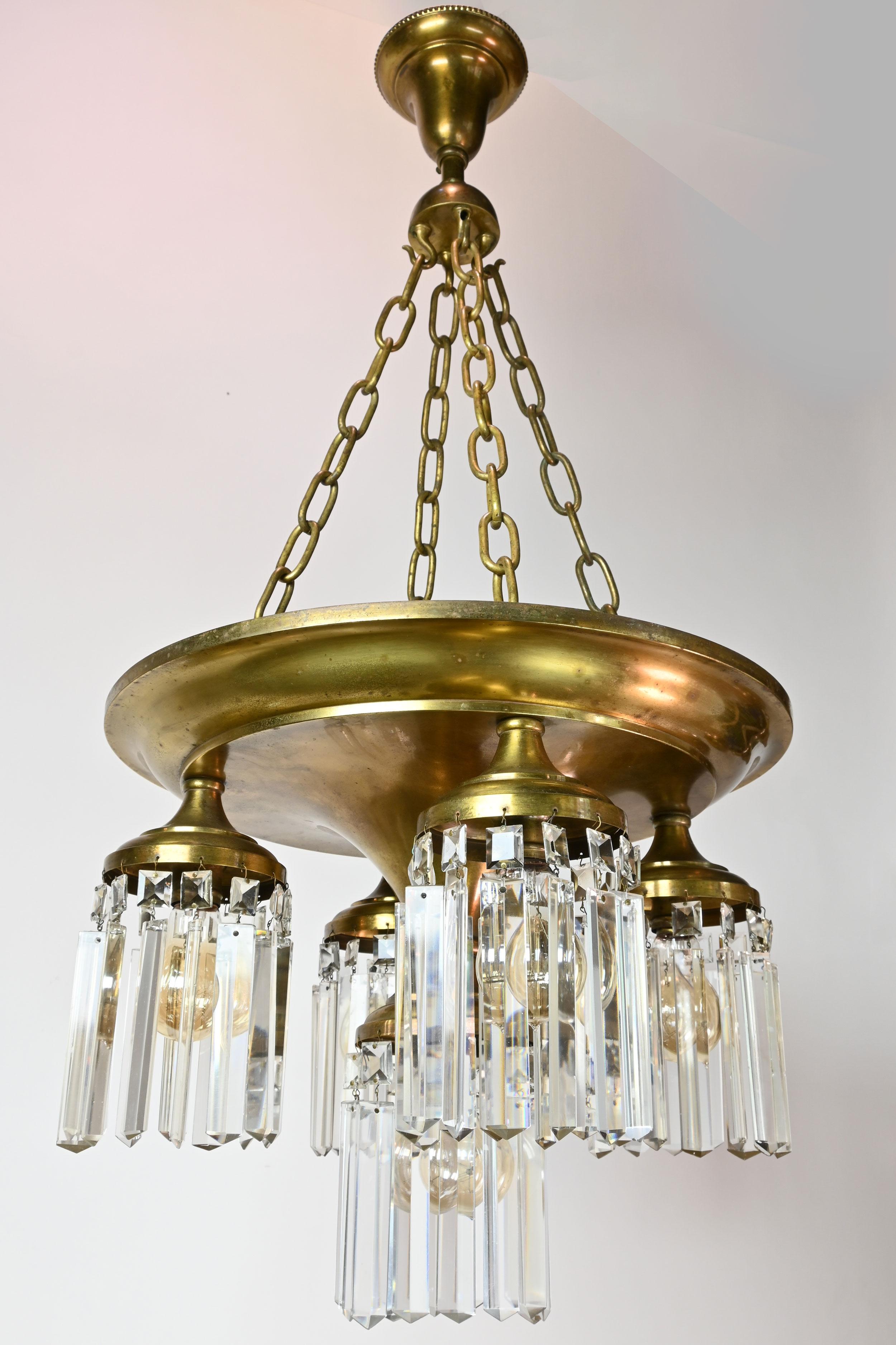 AA# 49943
Circa: Sold from a 1912 Beardslee catalogue 
Condition: Age Consistent, Well Made
Material: Spun Brass
Finish: Original
Origin: Paynesville, MN
Illumination: 5 standard Edison sockets

Dimensions: 39” drop x 18” diameter

Amazing