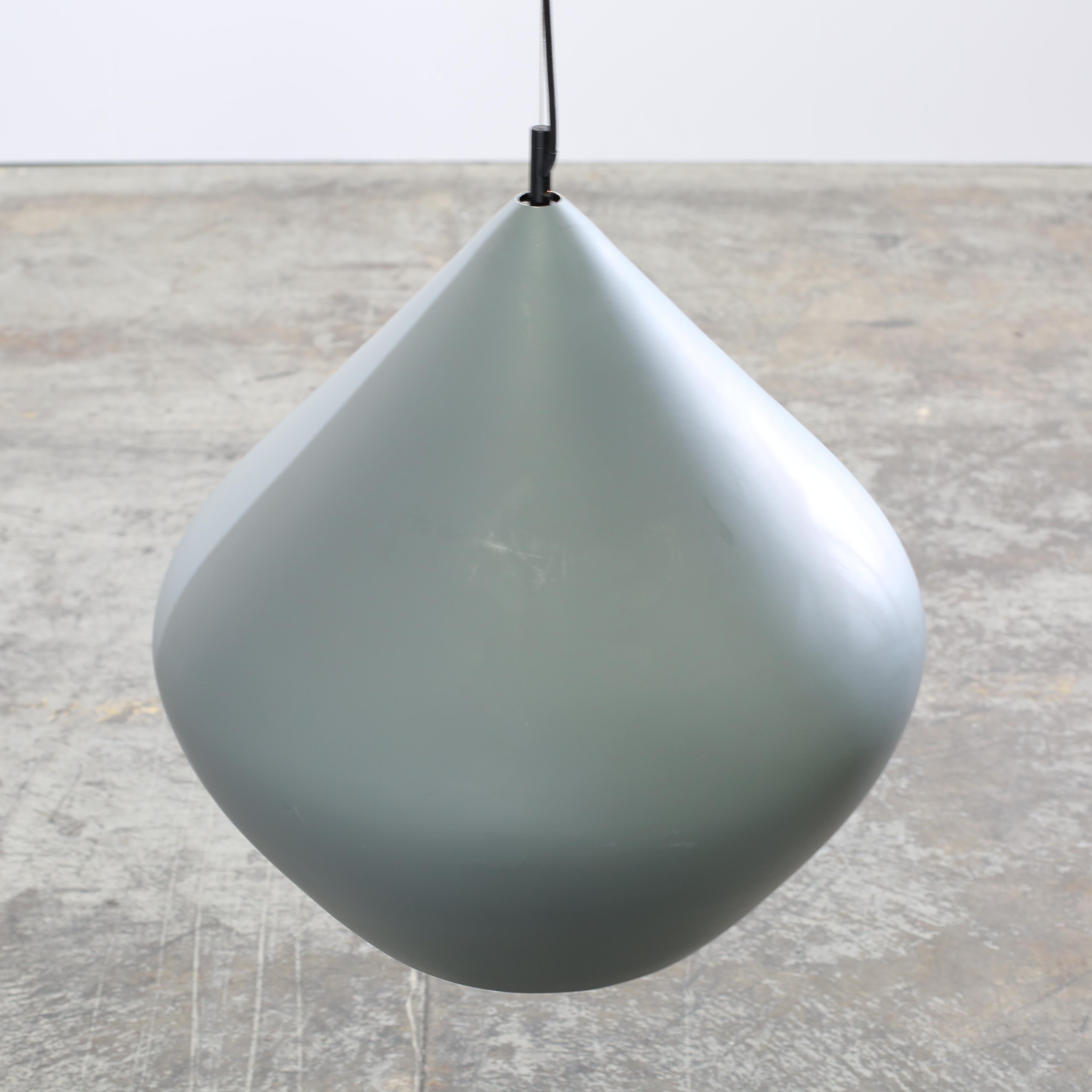 The Beat Stout Pendant Light by Tom Dixon is a bold statement piece that blends modern form with artisanal craftsmanship. Its oversized, curved silhouette creates a warm, sculptural presence. The rich shape beautifully diffuses ambient light, while