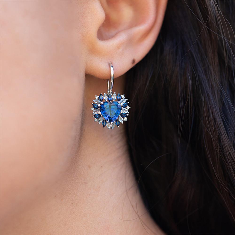 A classic symbol of love, the heart is the centre of our emotions. Our inspiration for the beating heart earrings come from the way that colours can represent our feelings & mood.

The centre heart sapphire is a deep blue, and the outside marquise