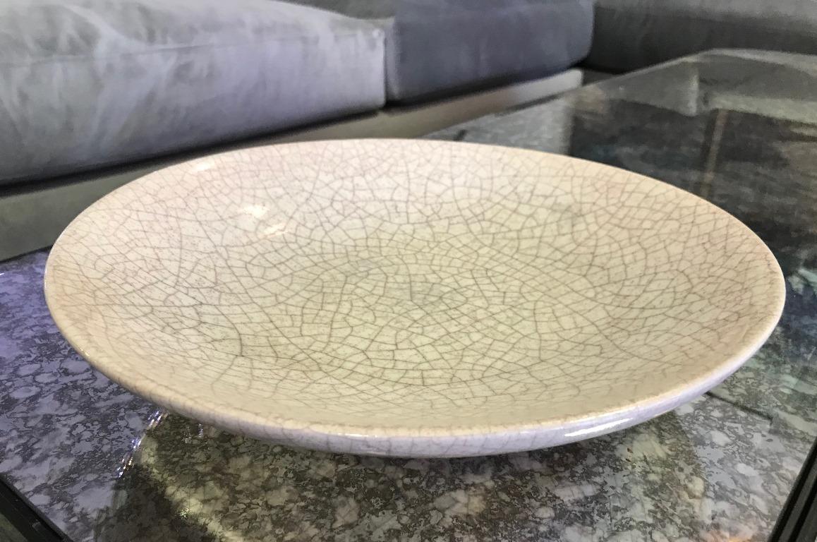 An exceptionally rare and fine early piece by famed American ceramist Beatrice Wood featuring her crackle glaze. 

Signed by Wood on underside with her early signature 