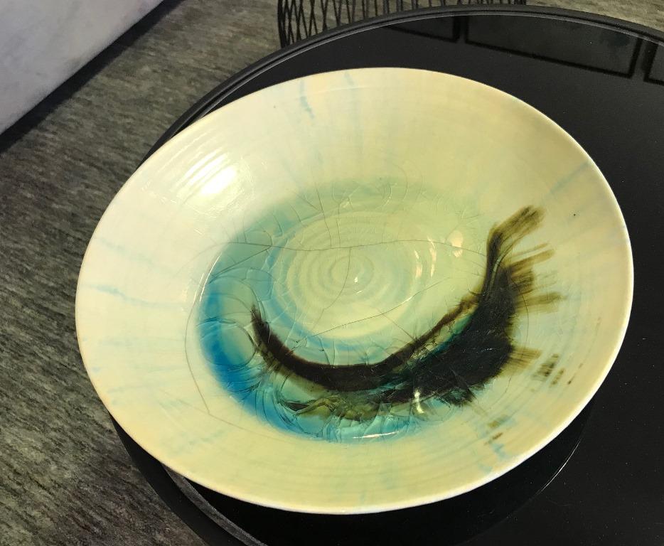 An exceptionally rare and fine early piece by famed American ceramist Beatrice Wood featuring a dynamic and unique design. The colors illuminate like stained glass under the glaze when lit. 

Signed by Wood on the underside with her early