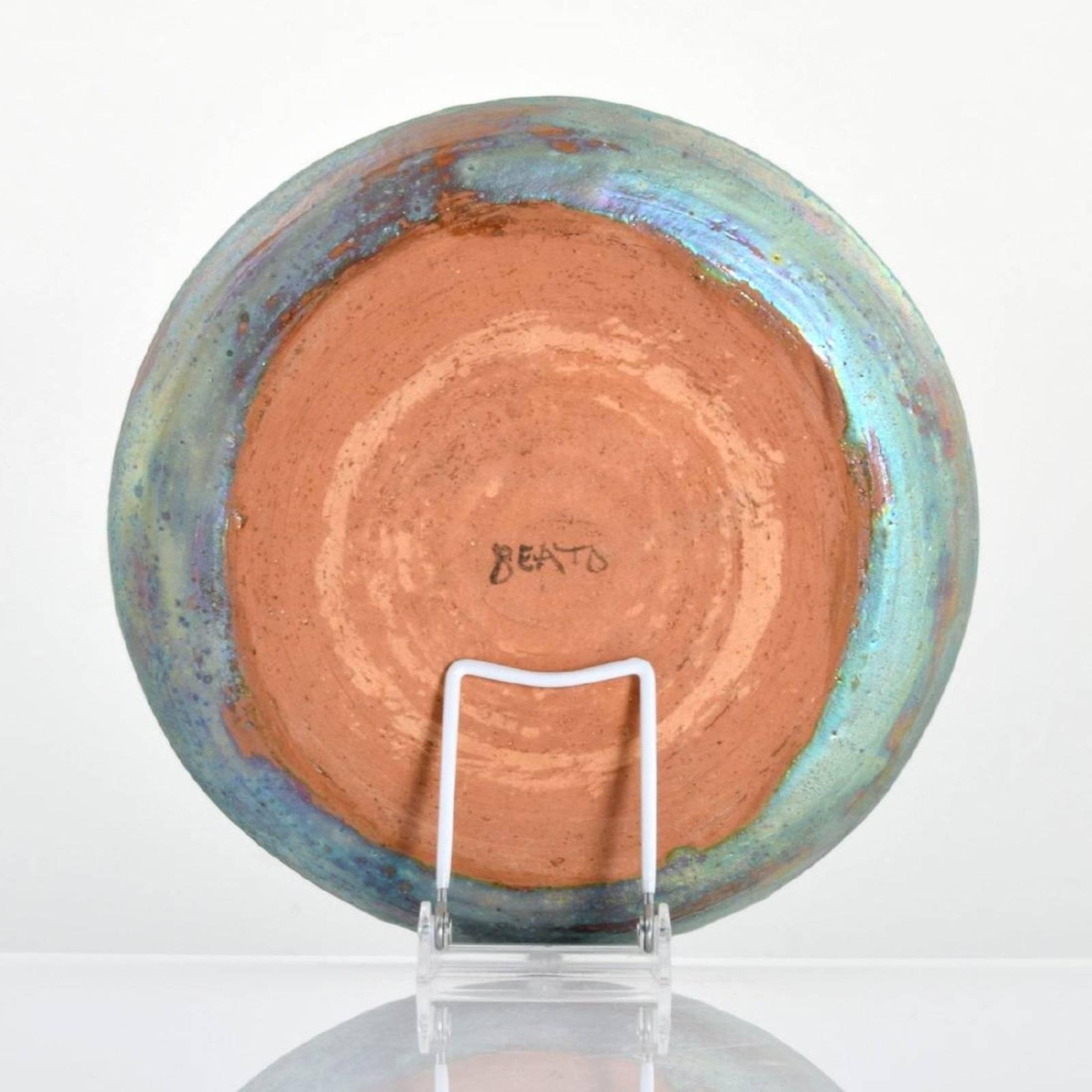 Plate by Beatrice Wood (1893-1998). Provenance: Zachary Waller Gallery, Los Angeles, California.

Markings: signed

Materials: glazed earthenware.
 