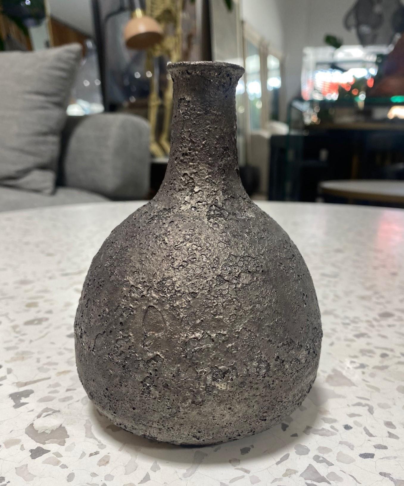 A wonderfully designed work by famed American California Studio master ceramist Beatrice Wood featuring a gorgeous, dark, iridescent metallic volcanic lava crater muted glaze.  A classic and timeless shape, the dark silver/chocolate metallic-like