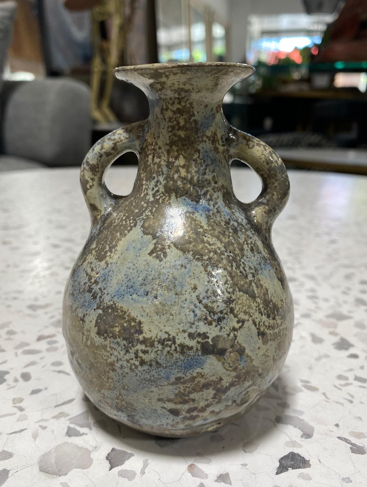 A wonderfully crafted and complexly glazed vase by famed American/California ceramicist Beatrice Wood featuring her highly coveted, often experimental, gorgeous luster (lustre) glaze (this one with an array of colors from shades of greys to blues).