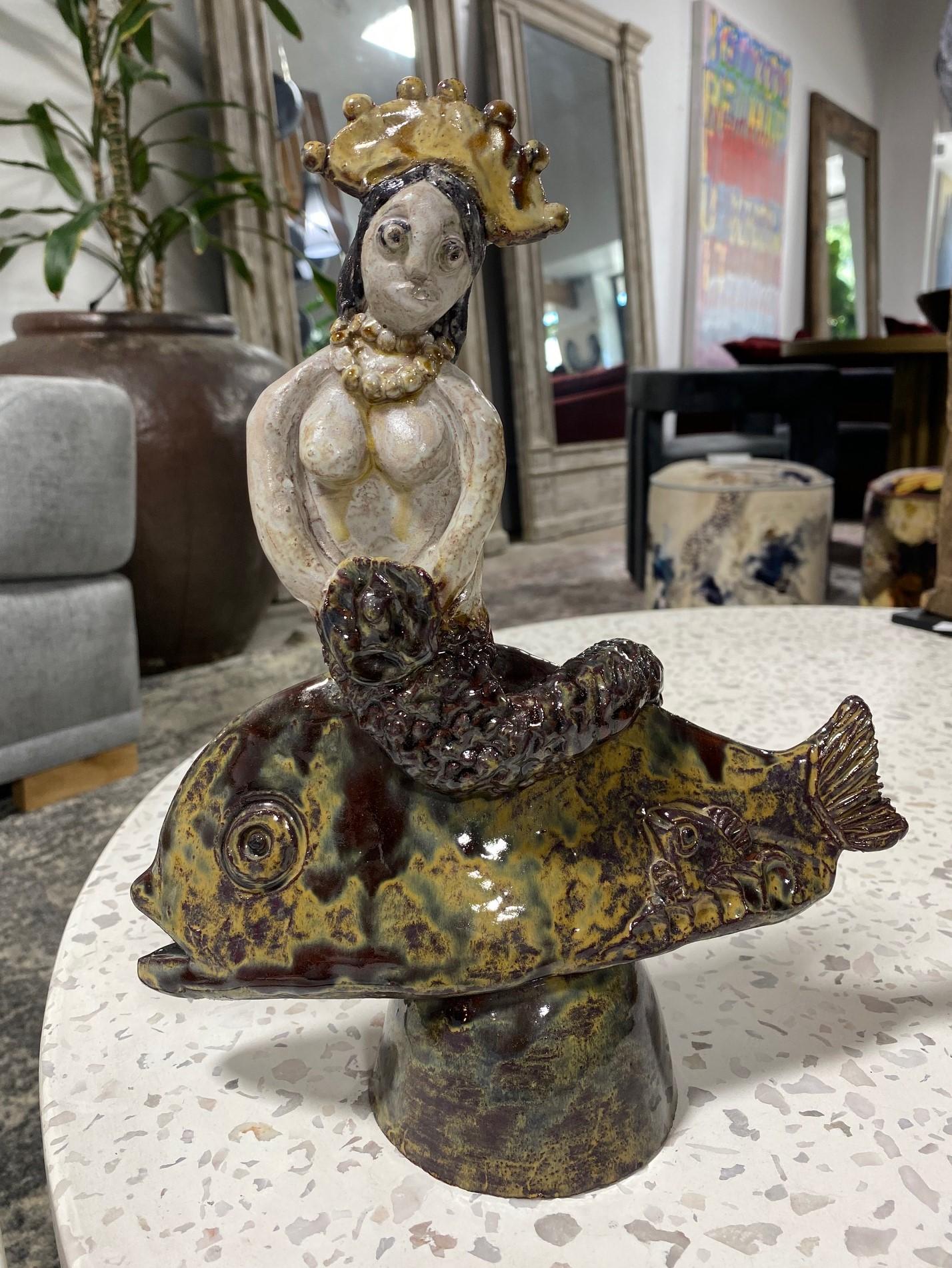 A wonderful, classic, and rare Fish and Mermaid lustre (luster) glazed earthenware figural sculpture by famed American/ California ceramist Beatrice Wood.

Signed by Beatrice in her customary 