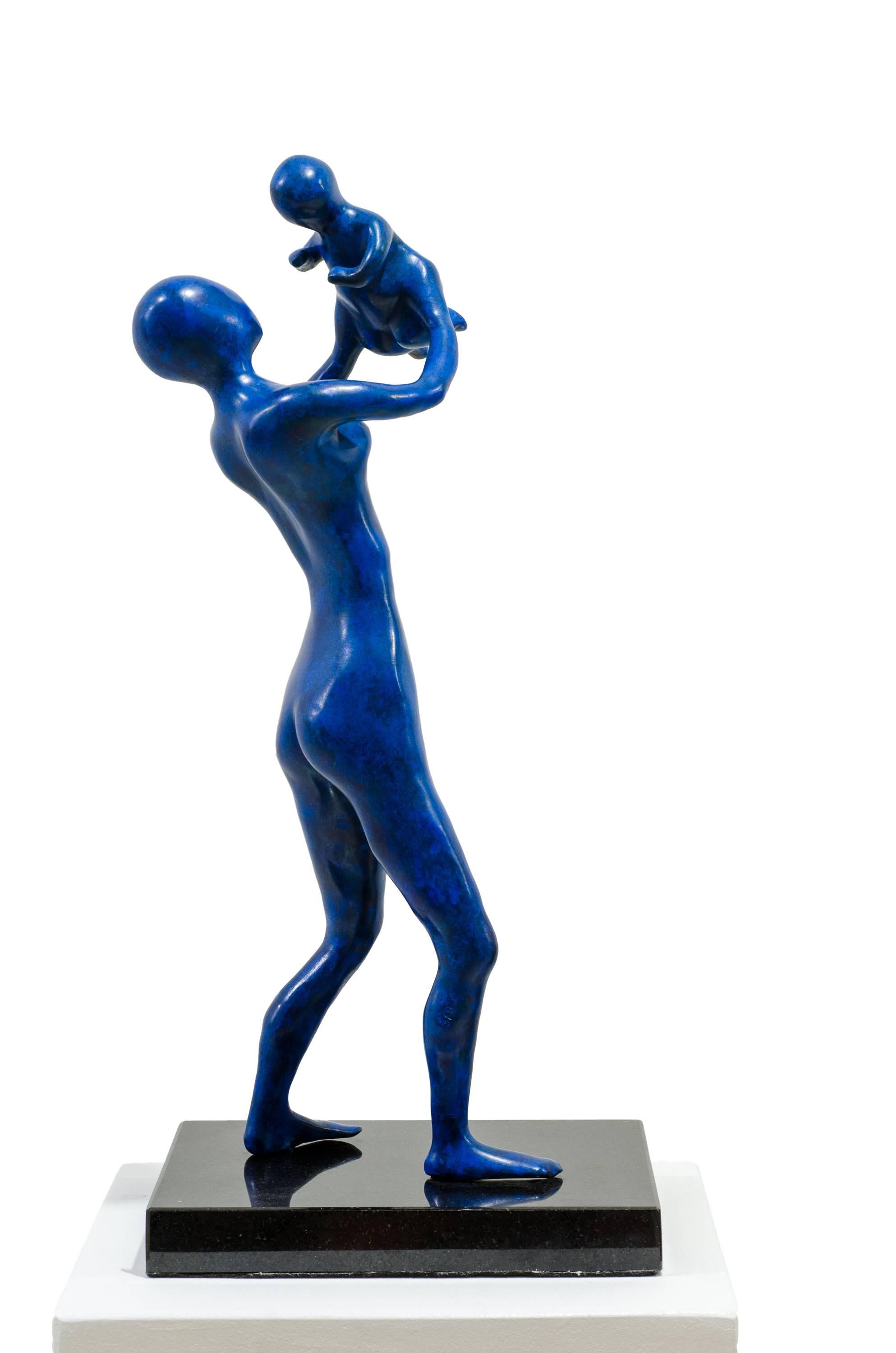 Mother in Blue. The mother proudly holds up her baby, enjoying the laughter For Sale 3