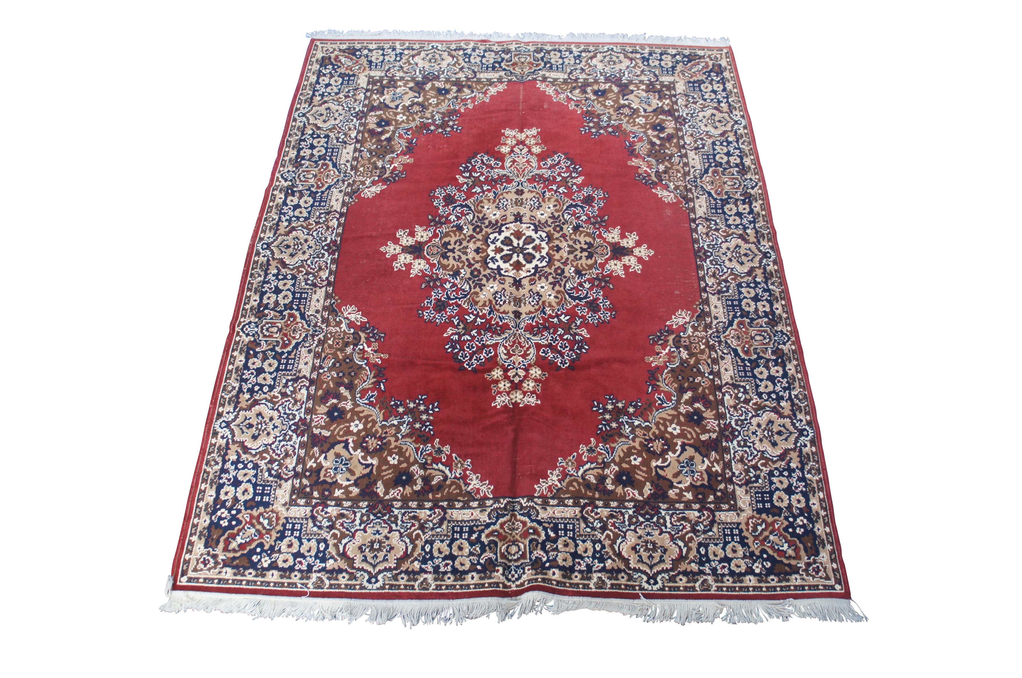Vintage Beaulieu of American Wolefin V area rug or carpet.  Made of poly-yarn featuring a floral all over design with red field and central medallion.  Reds, Tans, Blues, Creme, Browns.

Dimensions:
128