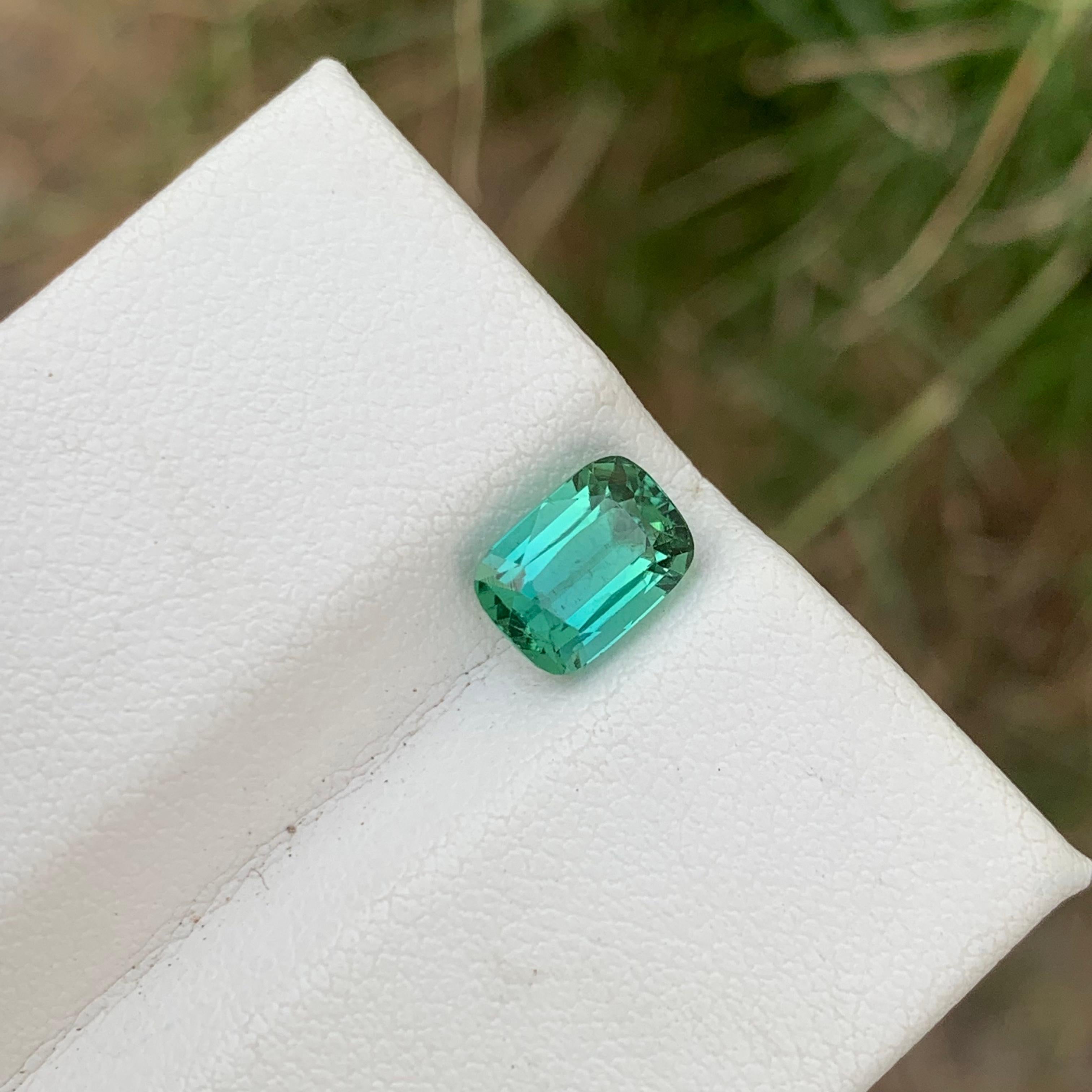 Loose Tourmaline 
Weight: 1.90 Carats 
Shape: Long Cushion 
Dimension: 7.9x5.7x5.1 Mm
Origin: Kunar Afghanistan 
Color: Blueish Green 
Treatment: Non
Certificate: On Customer Demand 
Blueish green tourmaline, a remarkable gemstone known for its