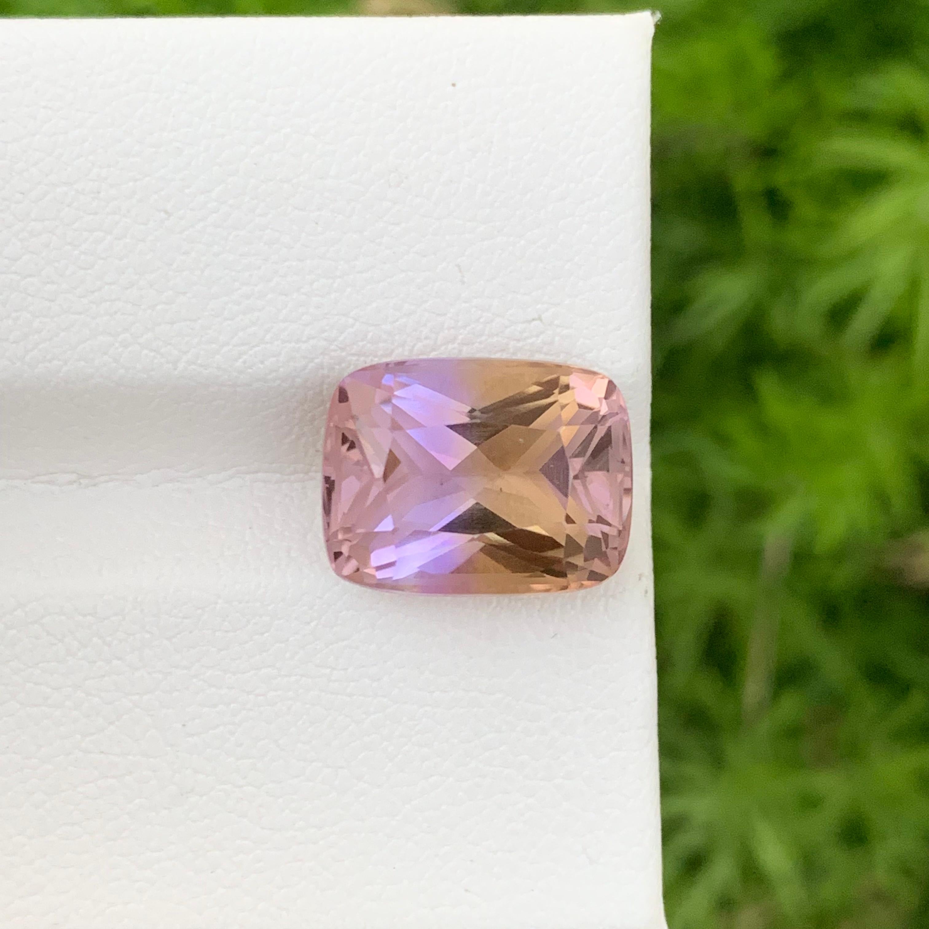 Faceted Ametrine 
Weight: 8.20 Carats 
Dimension: 13.7x10.5x8.5 Mm
Origin: Brazil
Color: Purple & Yellow 
Shape: Cushion
Certificate: On Customer Demand 
Ametrine is a captivating gemstone known for its striking combination of amethyst and citrine.