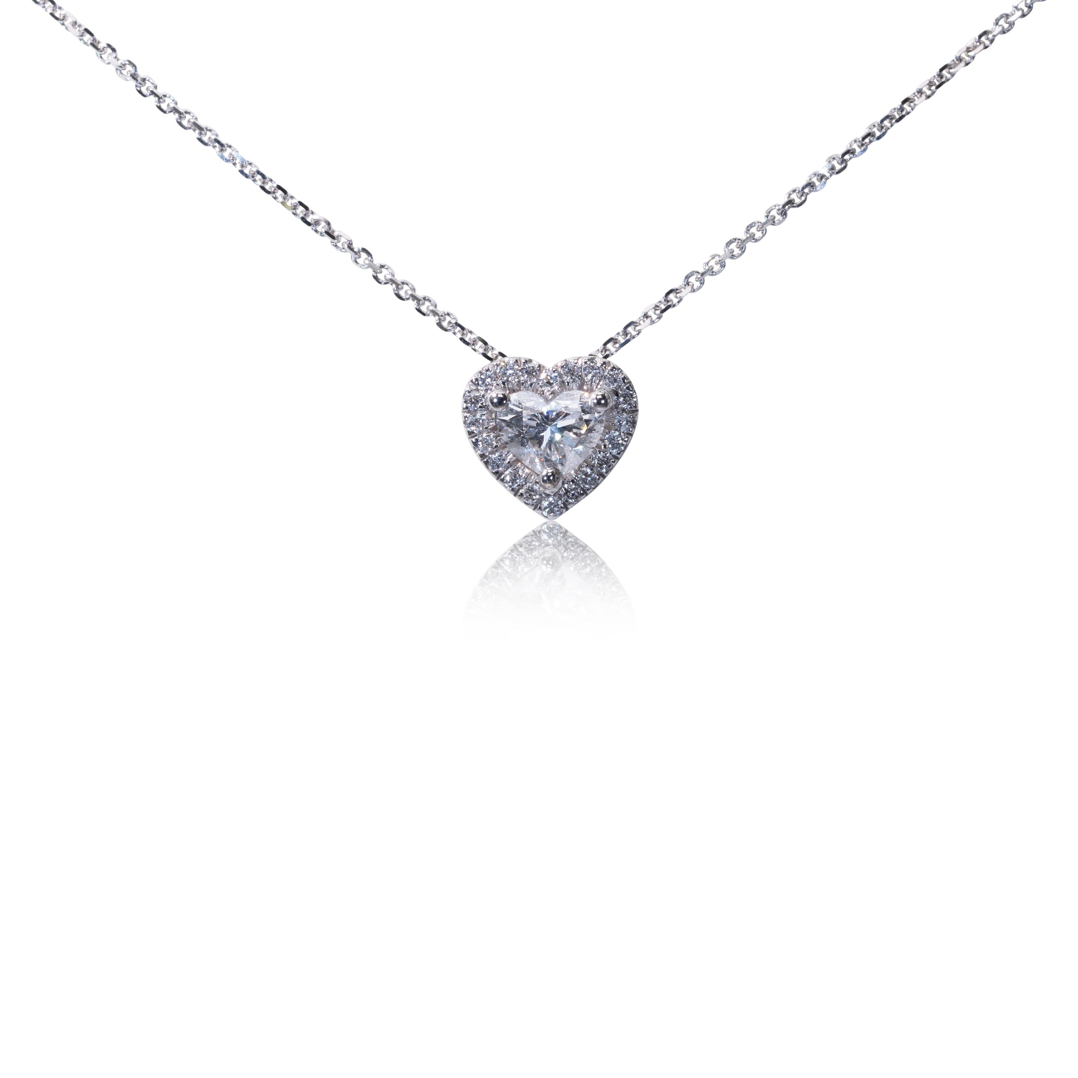Beautiful halo diamond pendant made from 18k white gold with 0.35 total carat of heart shape diamond and round brilliant diamonds. This pendant comes with a GIA certificate and a fancy box.

-1 diamond main stone of 0.30 ct.
cut: heart
color: