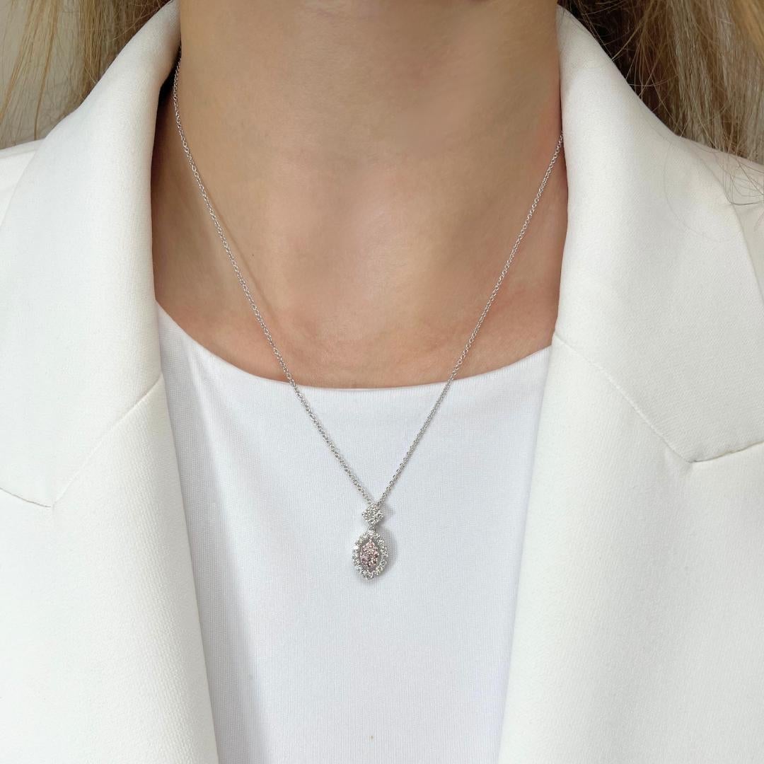Beautiful 0.59ct Diamonds Fancy-Colored Necklace with Pendant in 18k White Gold - IGI Certified

Enhance your elegance with this radiant necklace, featuring ten brilliant round natural fancy pink diamonds totaling 0.18-carat. These vibrant diamonds