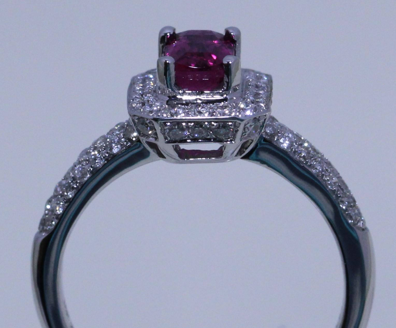 Pink Tourmaline Cocktail Ring.
This ring is studded with Pink Tourmaline 0 .60 carat 
It's micro set Diamonds all top quality with most elegant and beautiful design.