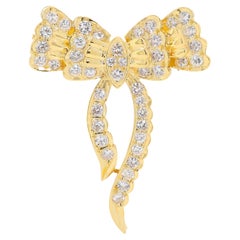 Precioso broche en forma de cinta de oro amarillo de 18 quilates con diamantes naturales de 0,70 quilates