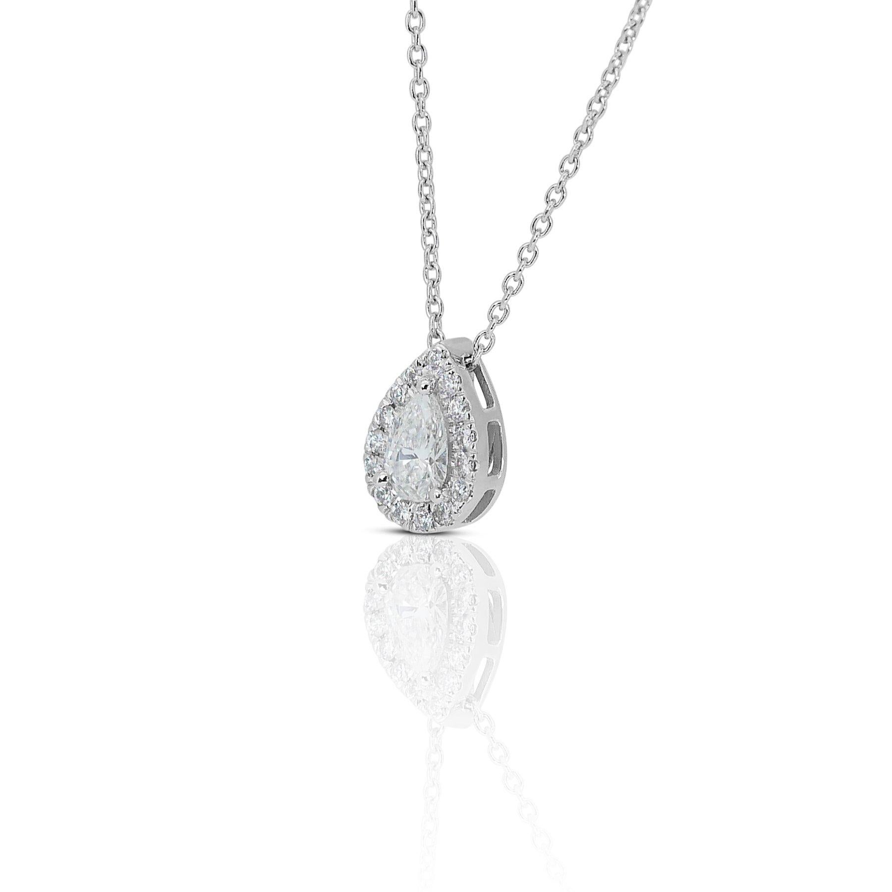 Beautiful 0.71 ct Pear Diamond Halo Necklace in 18k White Gold – GIA Certified

This luxurious pendant is expertly crafted in 18k white gold and features a stunning 0.71-carat pear-shaped diamond as its centerpiece. Accompanying the pear-shaped