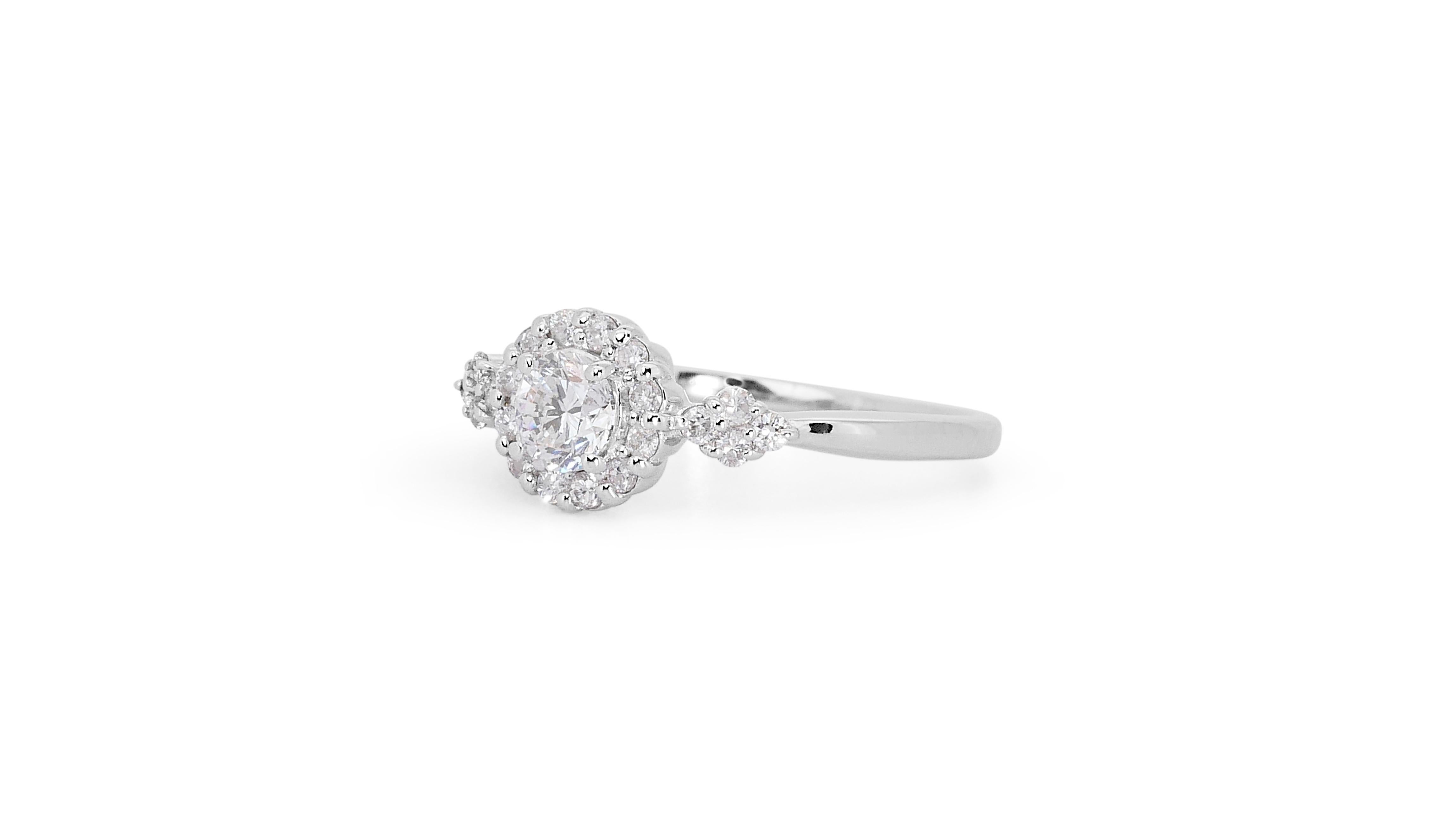 Beautiful 0.74ct Triple Excellent Ideal Cut Diamonds Halo Ring in 18k White Gold - GIA Certified

Elevate your style with this exquisite diamond ring, showcasing a brilliant 0.54-carat round diamond at its center. With a triple excellent ideal cut,