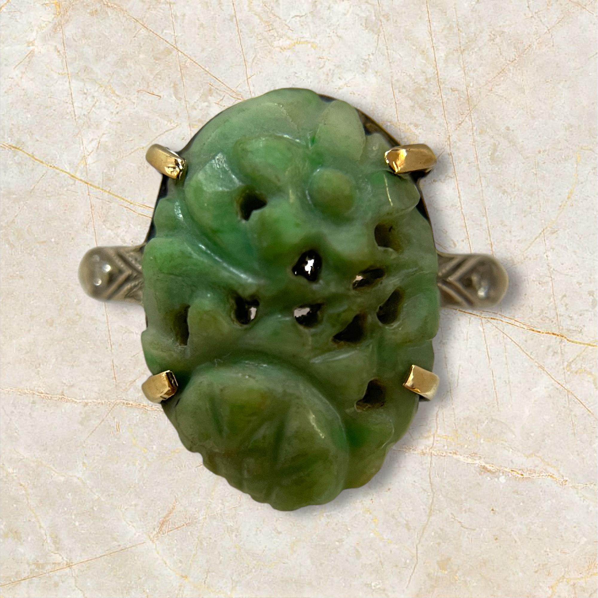 This exquisite 10K gold ring by H. Rosenthal showcases a beautifully hand-carved jade centerpiece. The intricate detailing of the jade, paired with the rich gold setting, creates a timeless and elegant piece that is perfect for any occasion. Add a