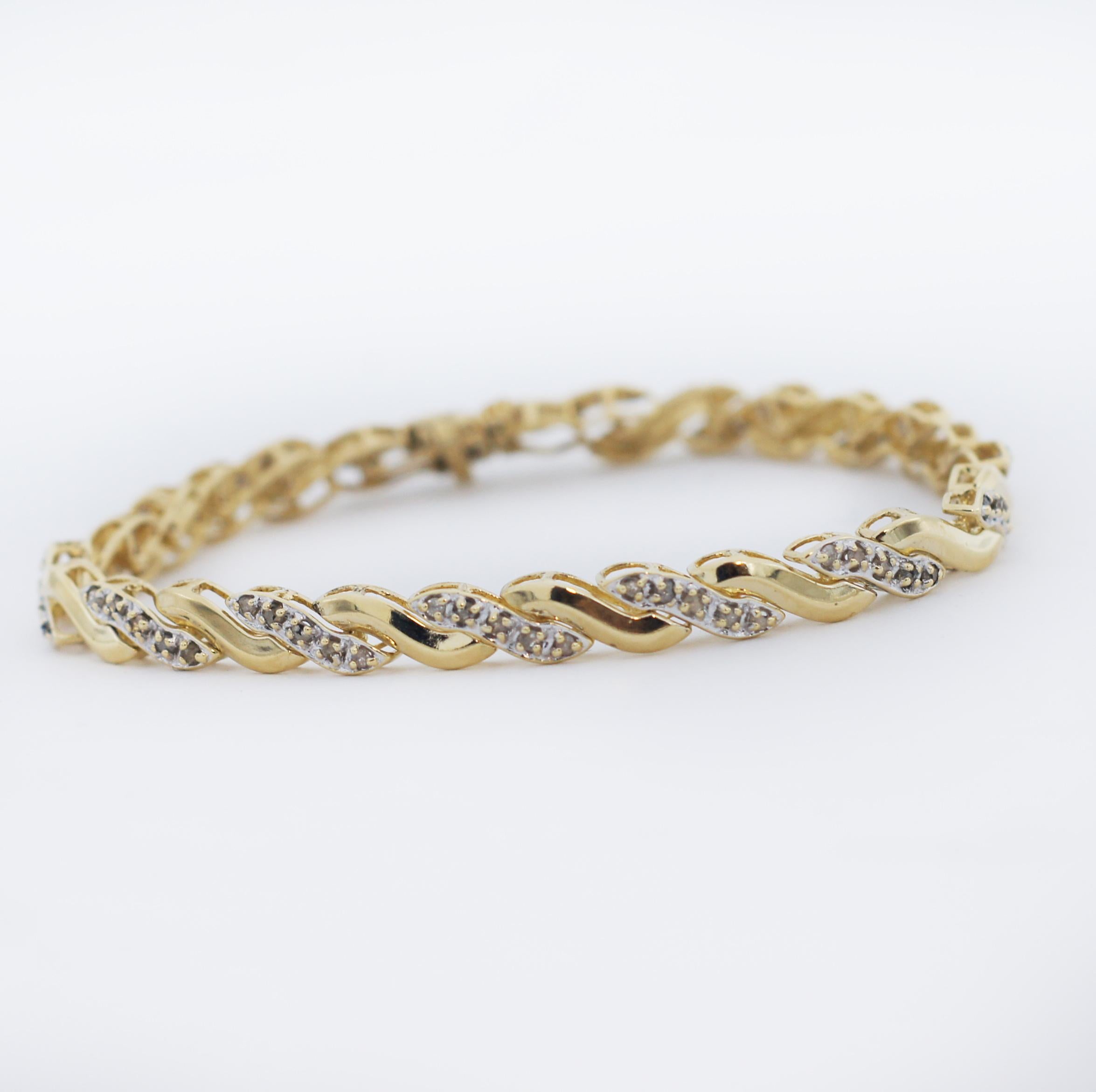 Beautiful wave shaped links
Some links are paved with diamonds
Made in 10K Yellow Gold
Total bracelet weight of 9.2 grams
Approx. 1/2 carats in Diamonds
Bracelet 7