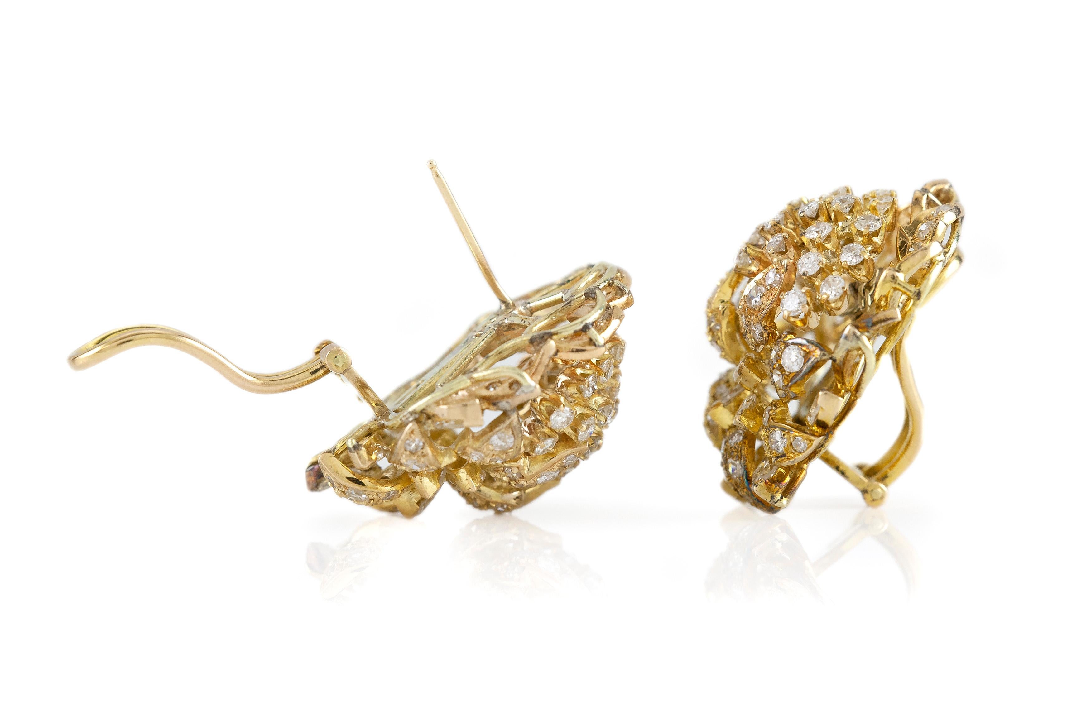 The earrings is finely crafted in 14k yellow gold with diamonds weighing approximately total of 5.00 carat.