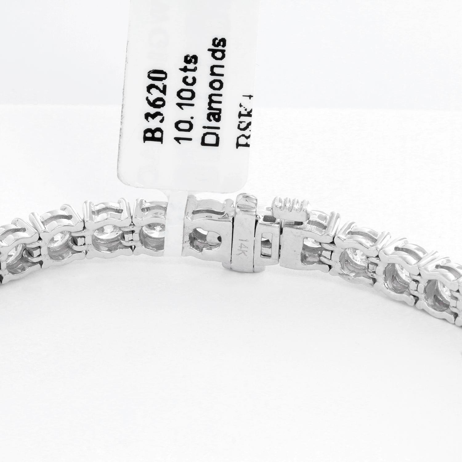 Beautiful 14k White Gold and 10.10 ct. Diamond Tennis Bracelet - This beautiful bracelet features 10.10 carats of round brilliant cut diamonds (GH-color, SI2-SI3 clarity) set in 14k white gold. Bracelet measures apx. 7-inches in length. Total weight