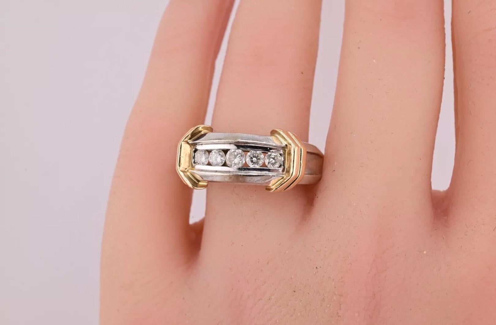 This is a beautiful 14 karat diamond ring. There are five diamonds in the center of the ring with a clarity of SI to I clarity. The color range is near colorless. The weight of the ring is 8.53 grams. The ring size is size 10 1/2. If you have any
