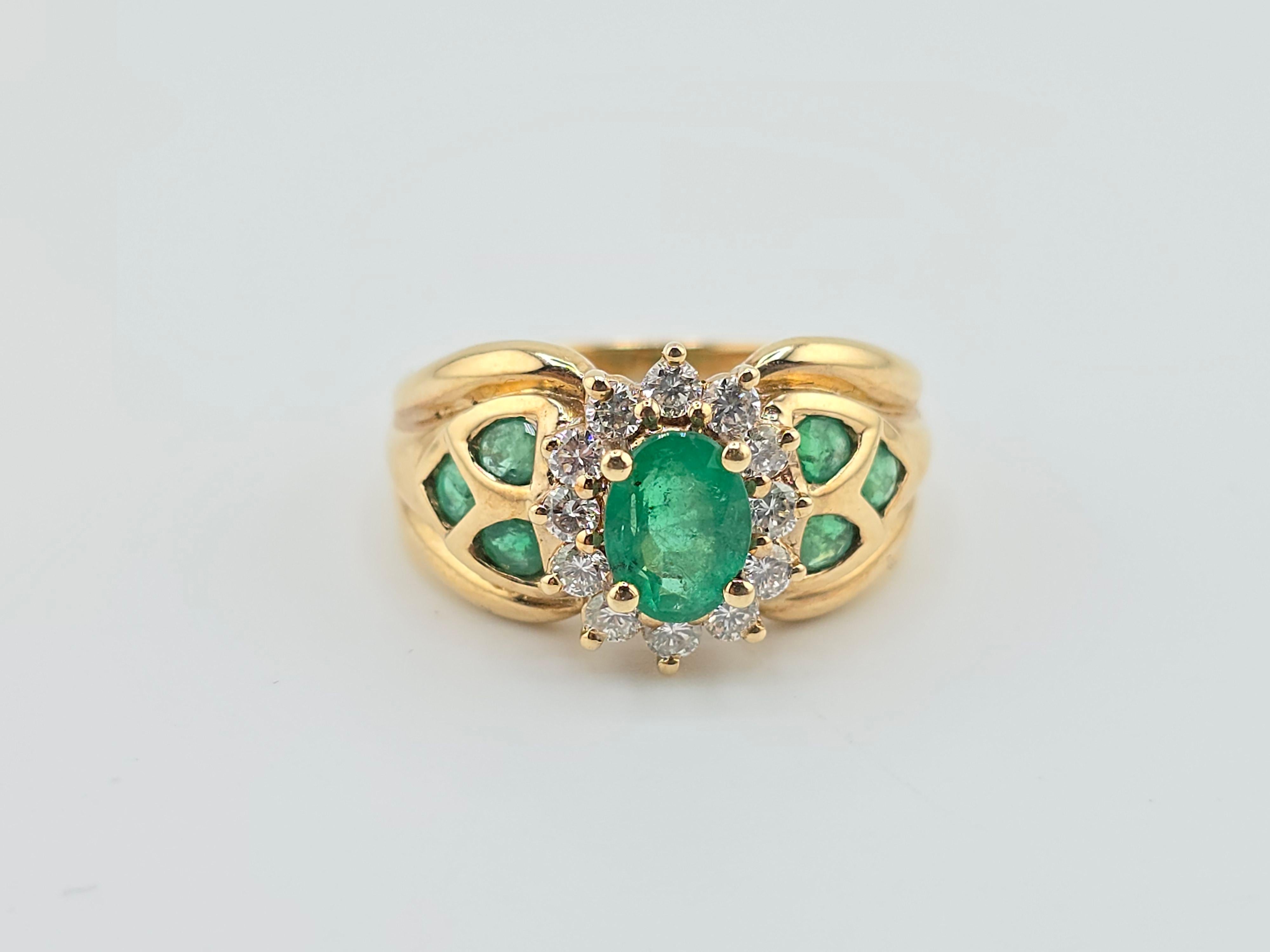 This is a fantastic 14 karat yellow gold ring with fabulous emeralds and diamonds. The emerald has a nice rich, vibrant green color, and the diamonds are all very clean and good color VS to SI quality. The weight of the ring is 6.01 grams and the