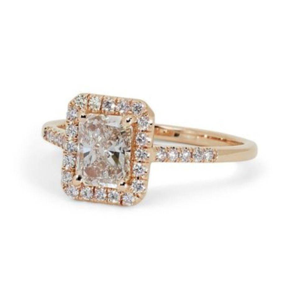 
This stunning ring features a dazzling 1.5 carat radiant cut natural diamond as the center stone. The diamond is I in color and VS1 in clarity, with a very good cut grade. The ring is also adorned with 0.25 carat of round brilliant side diamonds,