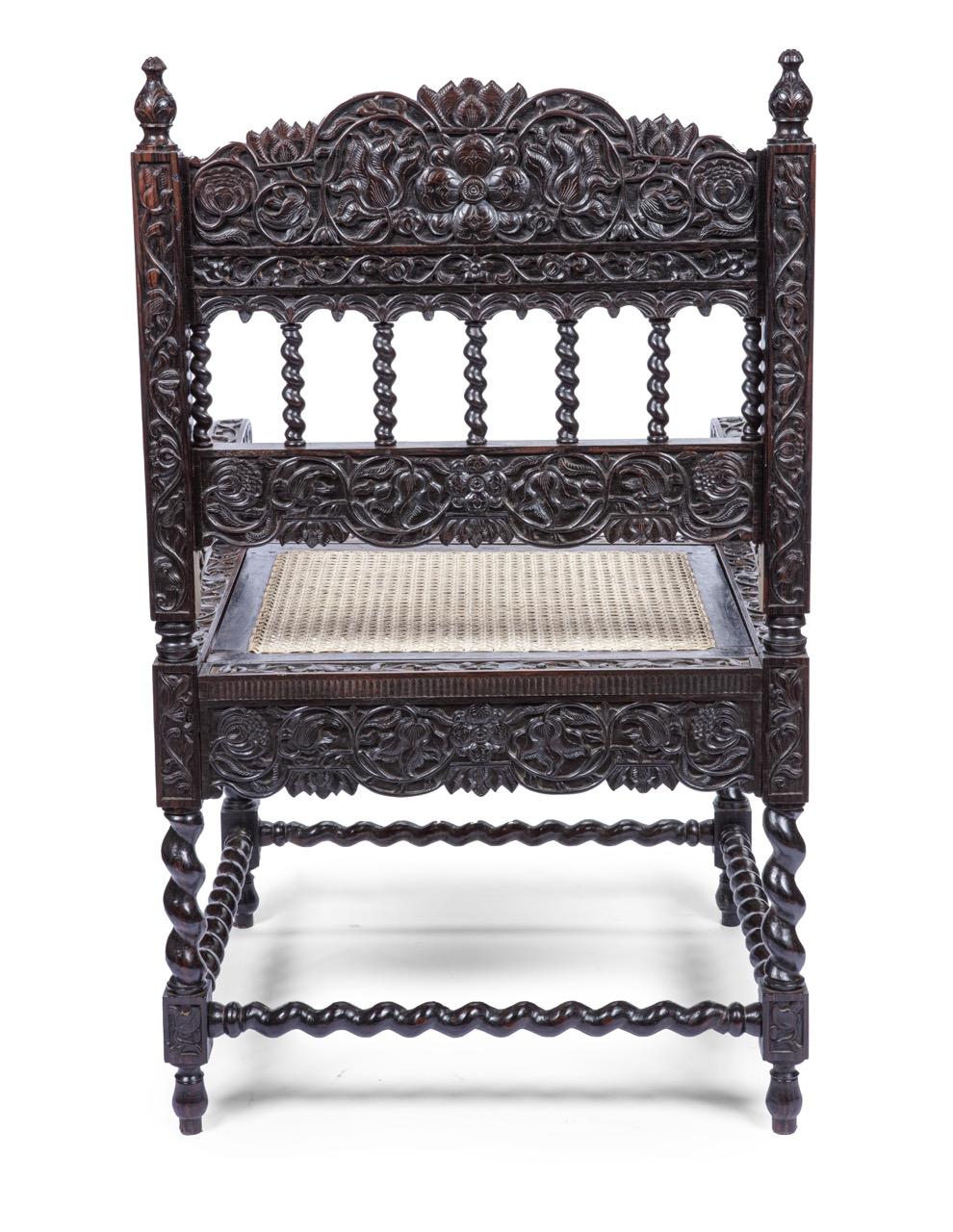 A Dutch-colonial Macassar ebony (Diospyros celebica) armchair

Batavia (Jakarta), circa 1680

H. 89.5 x W. 54.5 x D. 58 cm

The bold carvings of flowers are decorated on all sides, type VI according to Jan Veenendaal’s classification in Wonen