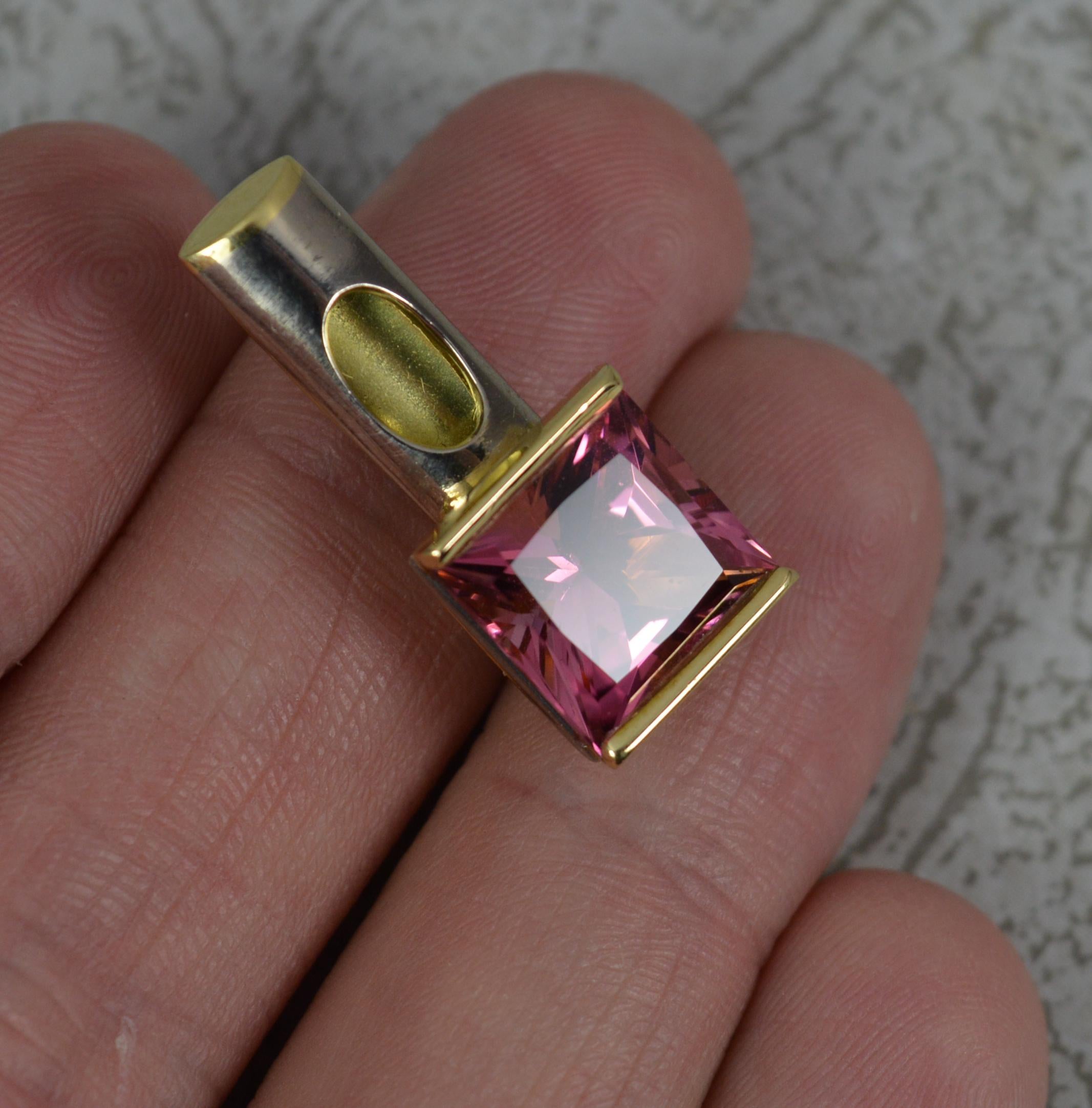A superb statement pendant.
Solid 18 carat yellow gold example.
Designed with a princess cut vivid, pink tourmaline stone to base.

CONDITION ; Excellent. Beautiful example. Polished. Well set stones. Strong hinge to clasp. Please view