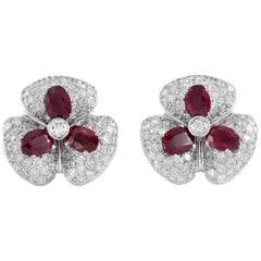 Magnifiques boucles d'oreilles fleur en or blanc 18 carats avec rubis et diamants